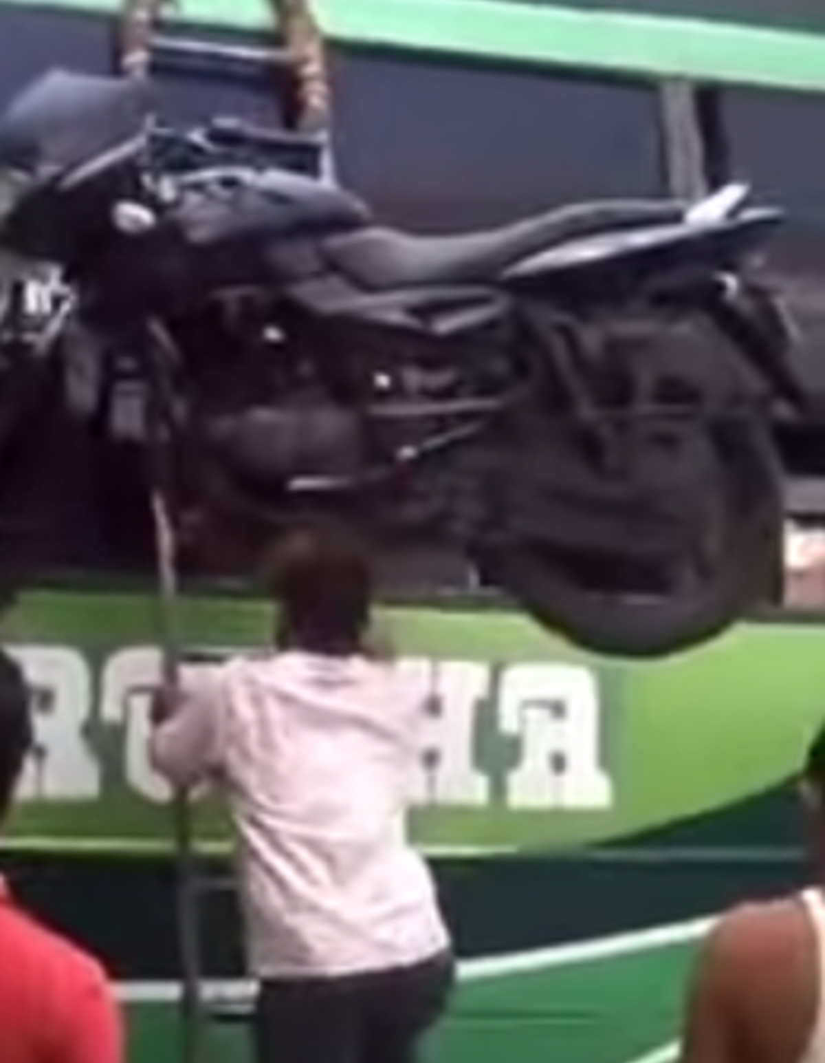 Moving a Motorcycle on Your Head Is the Best and Only Way To Move a