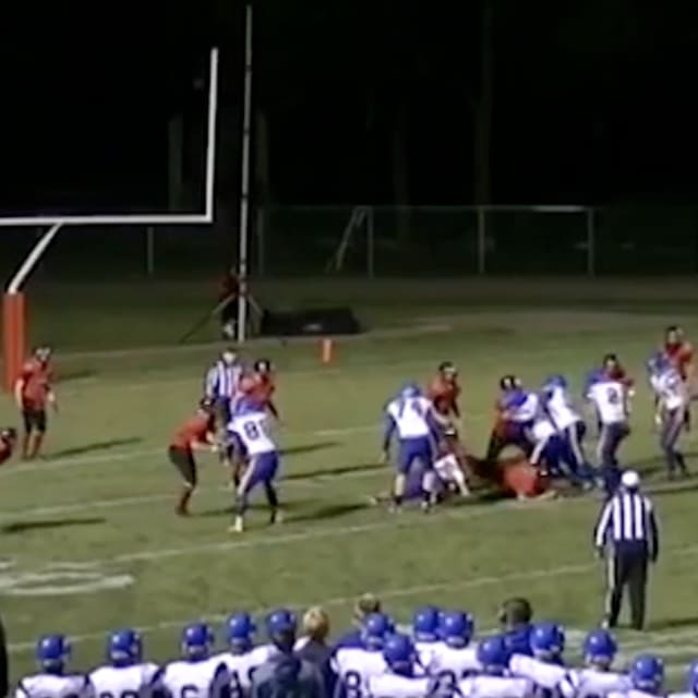 High School Football Player Intercepts Quarterback Who Tries to Spike