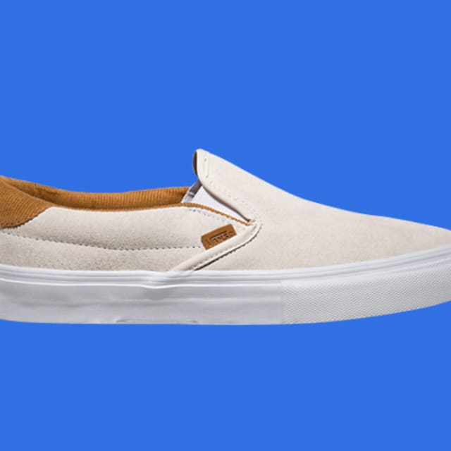 white perf leather slip on vans