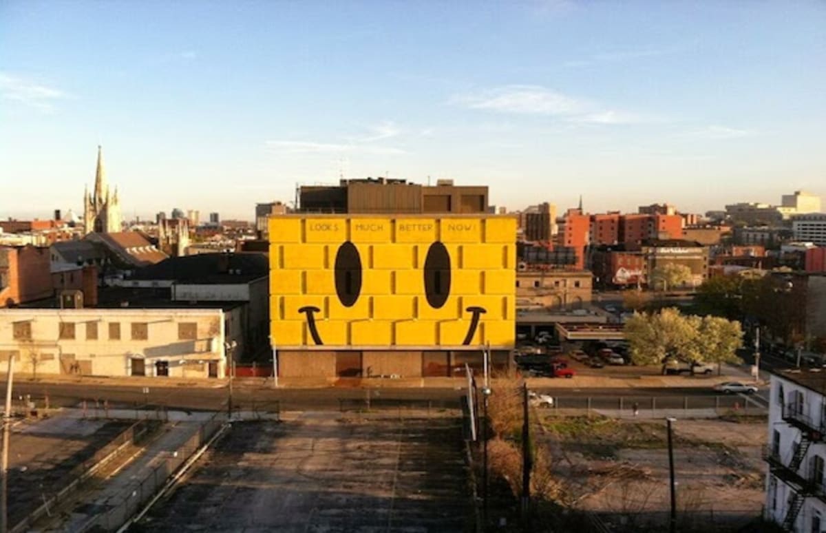 Escif Brightens Up a Sad Baltimore Neighborhood With a Huge Smiley Face