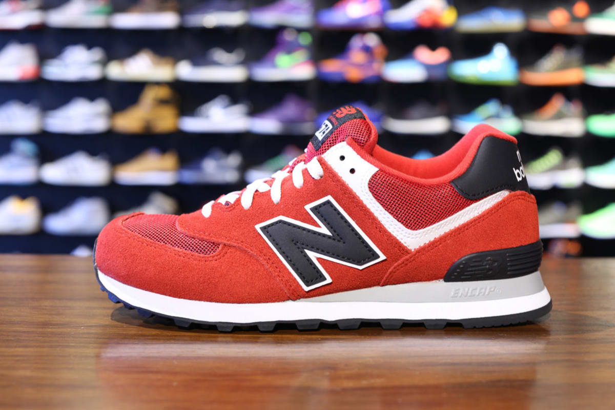 black and orange new balance 574