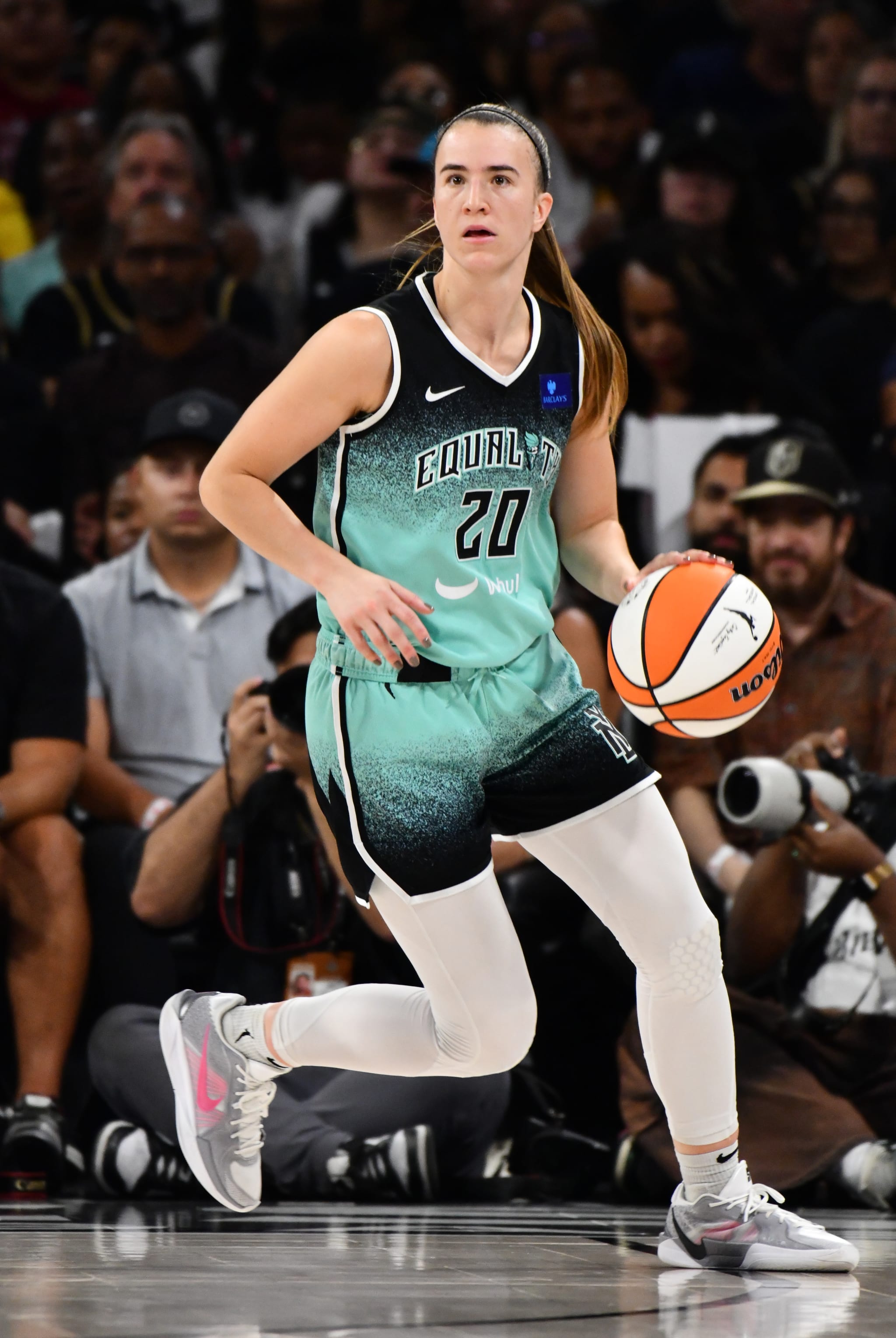 Sabrina Ionescu dribbling basketball
