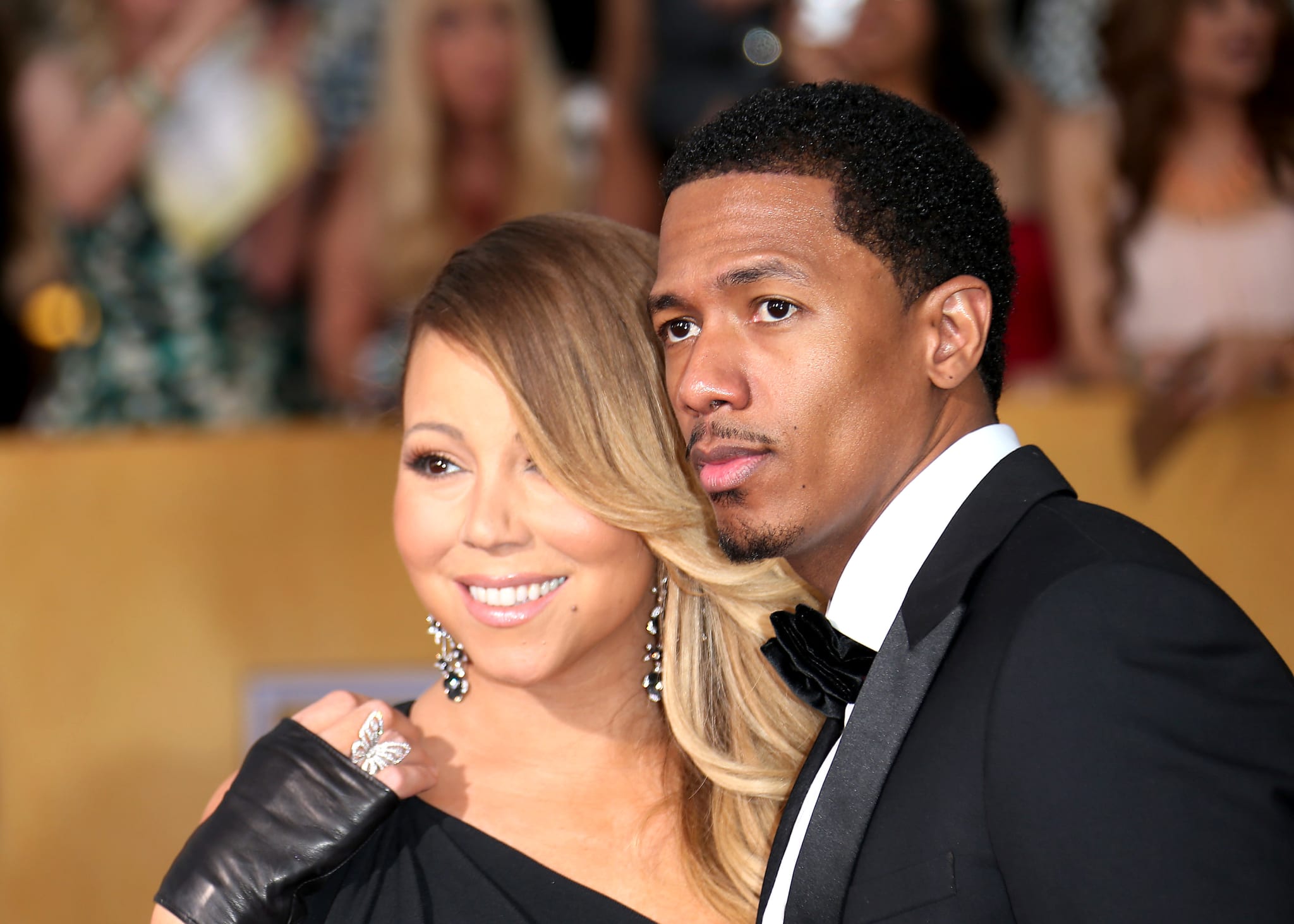 LOS ANGELES, CA - JANUARY 18: Mariah Carey and Nick Cannon (R) arrive at the 20th Annual Screen Actors Guild Awards at the Shrine Auditorium on January 18, 2014 in Los Angeles, California.