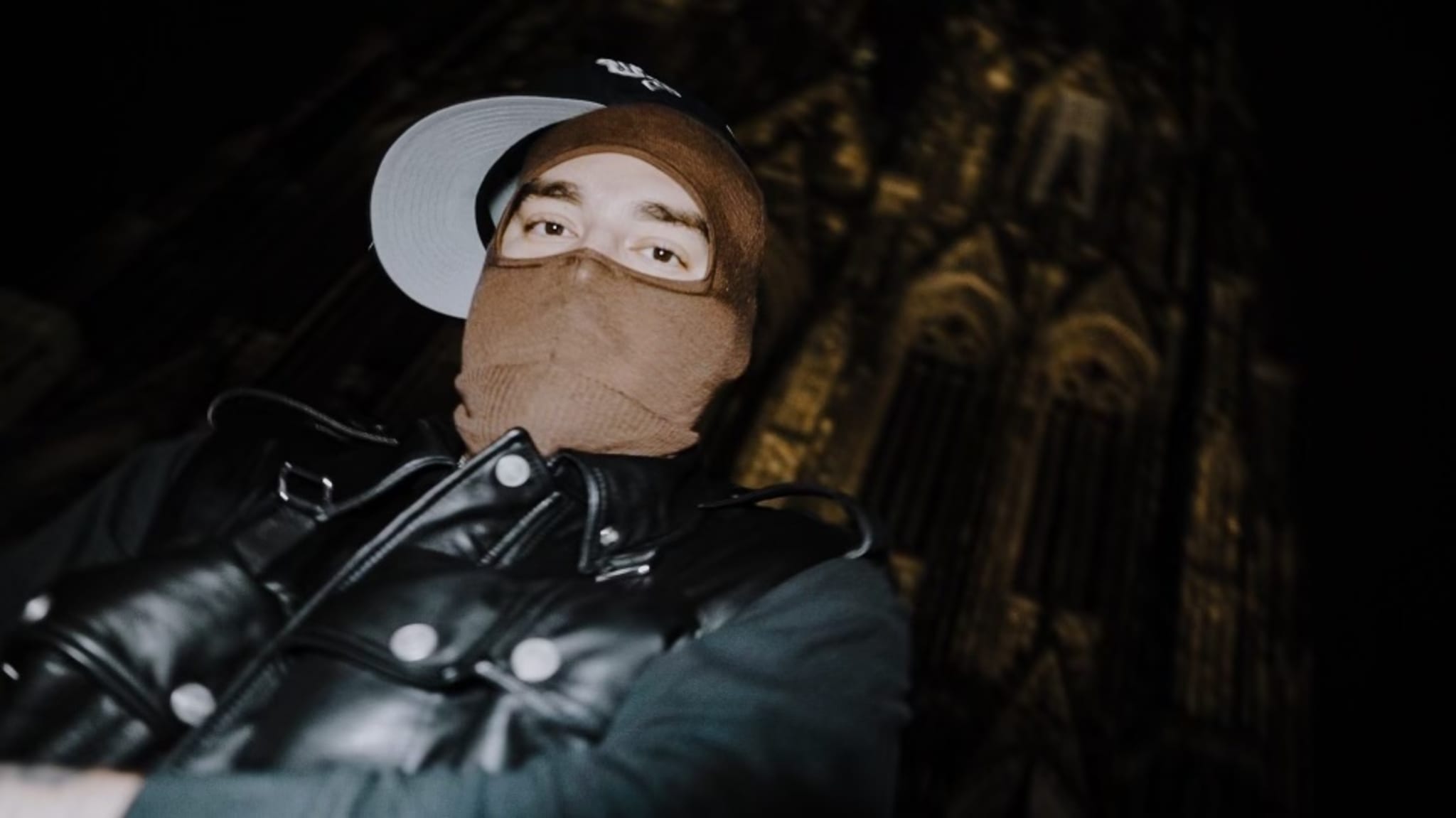 Yeat wearing a brown mask