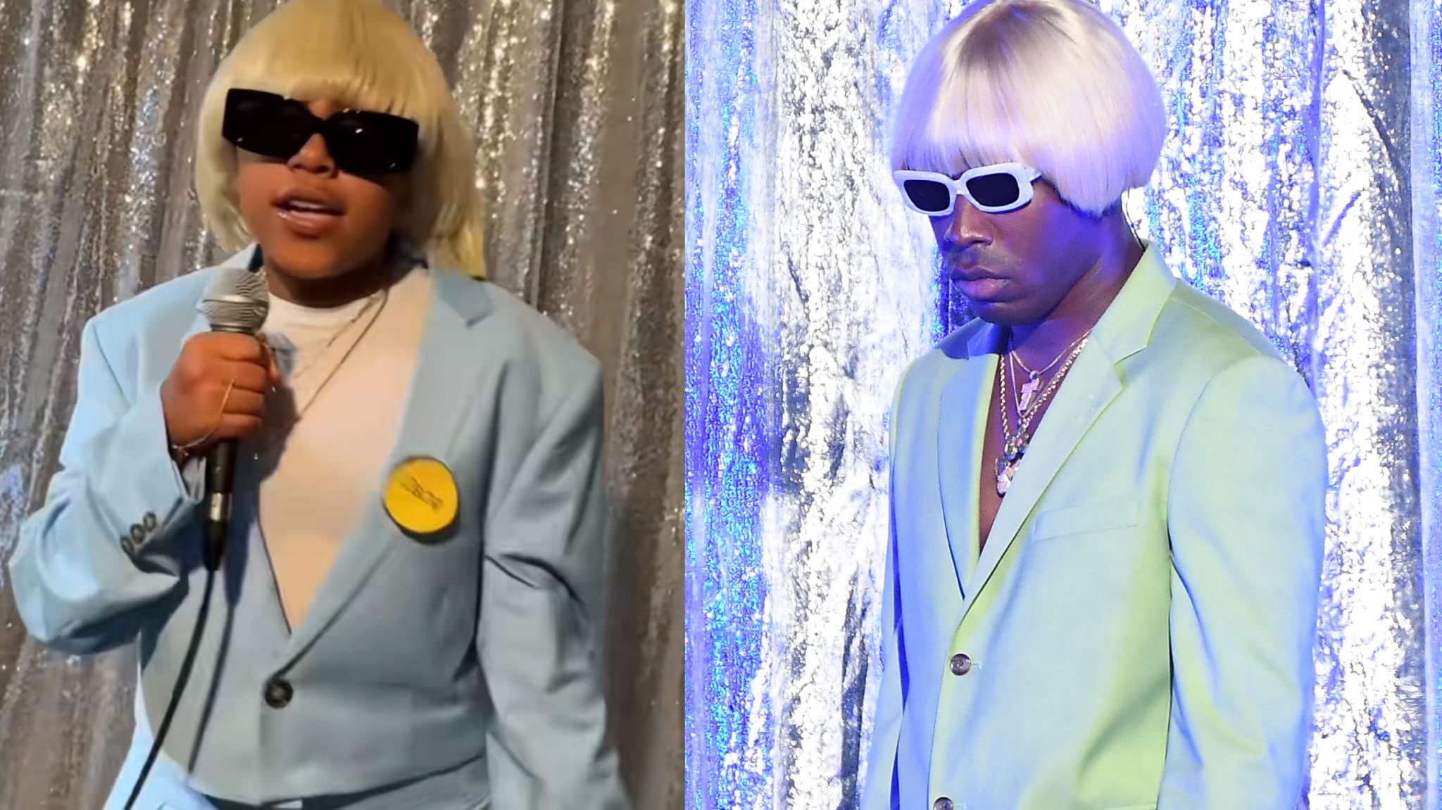 Two people in light blue suits and blonde wigs, one holding a microphone. Both wear sunglasses, standing against a shiny backdrop.