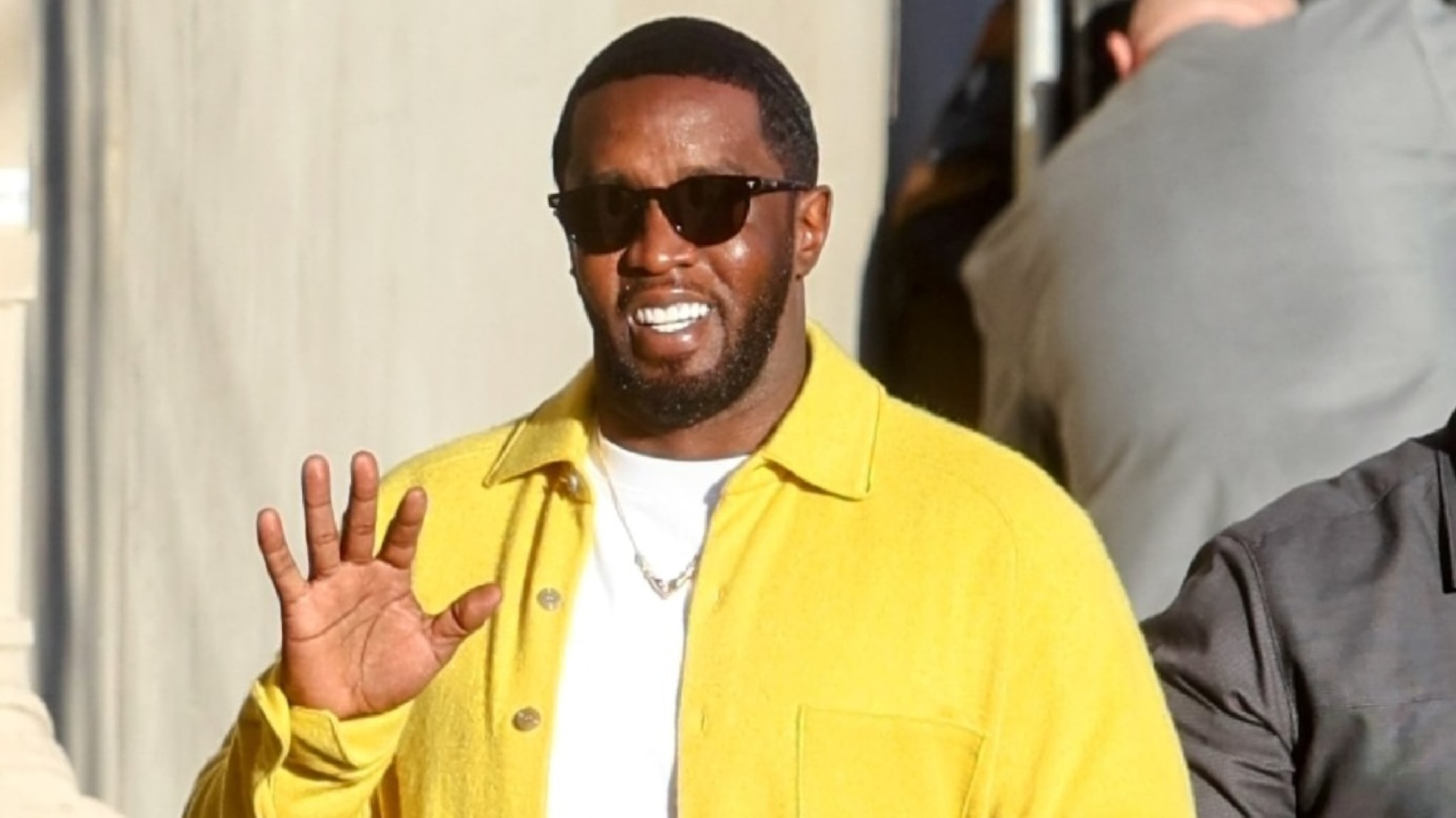 Diddy walking on a street.