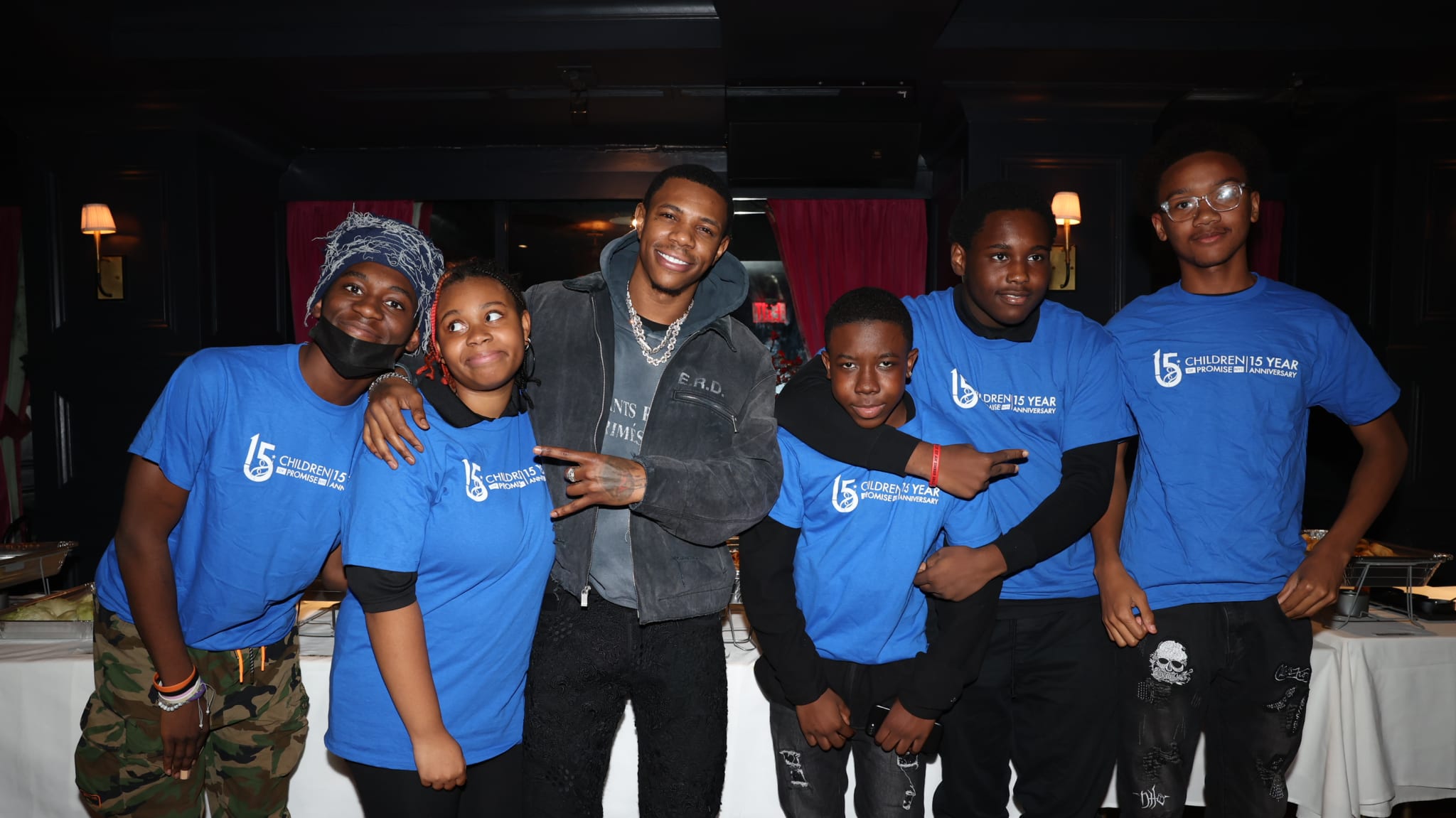 A Boogie Wit Da Hoodie at a Thanksgiving dinner for Children of Promise NYC