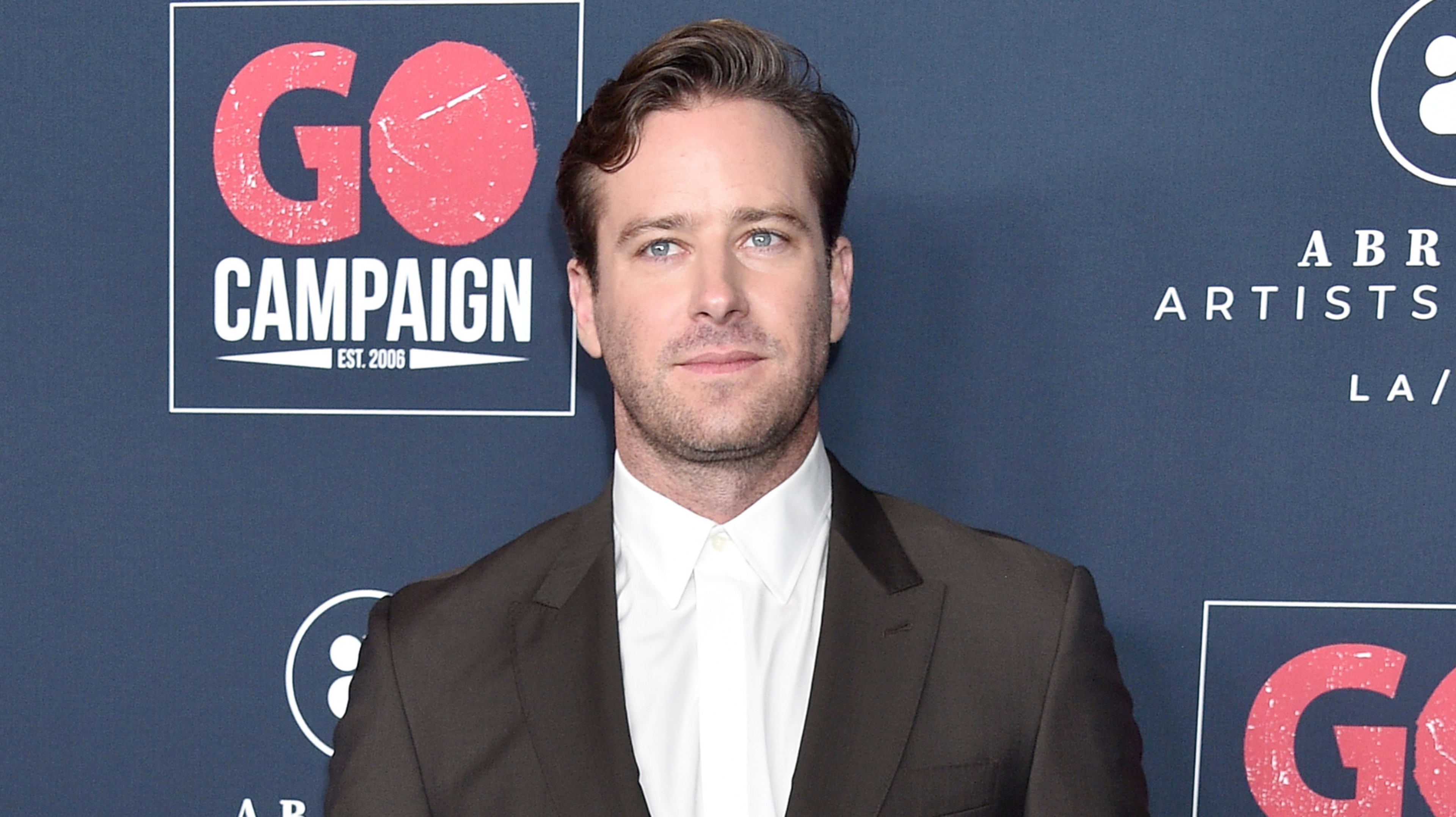 Armie Hammer in a suit and tie at a GO Campaign event