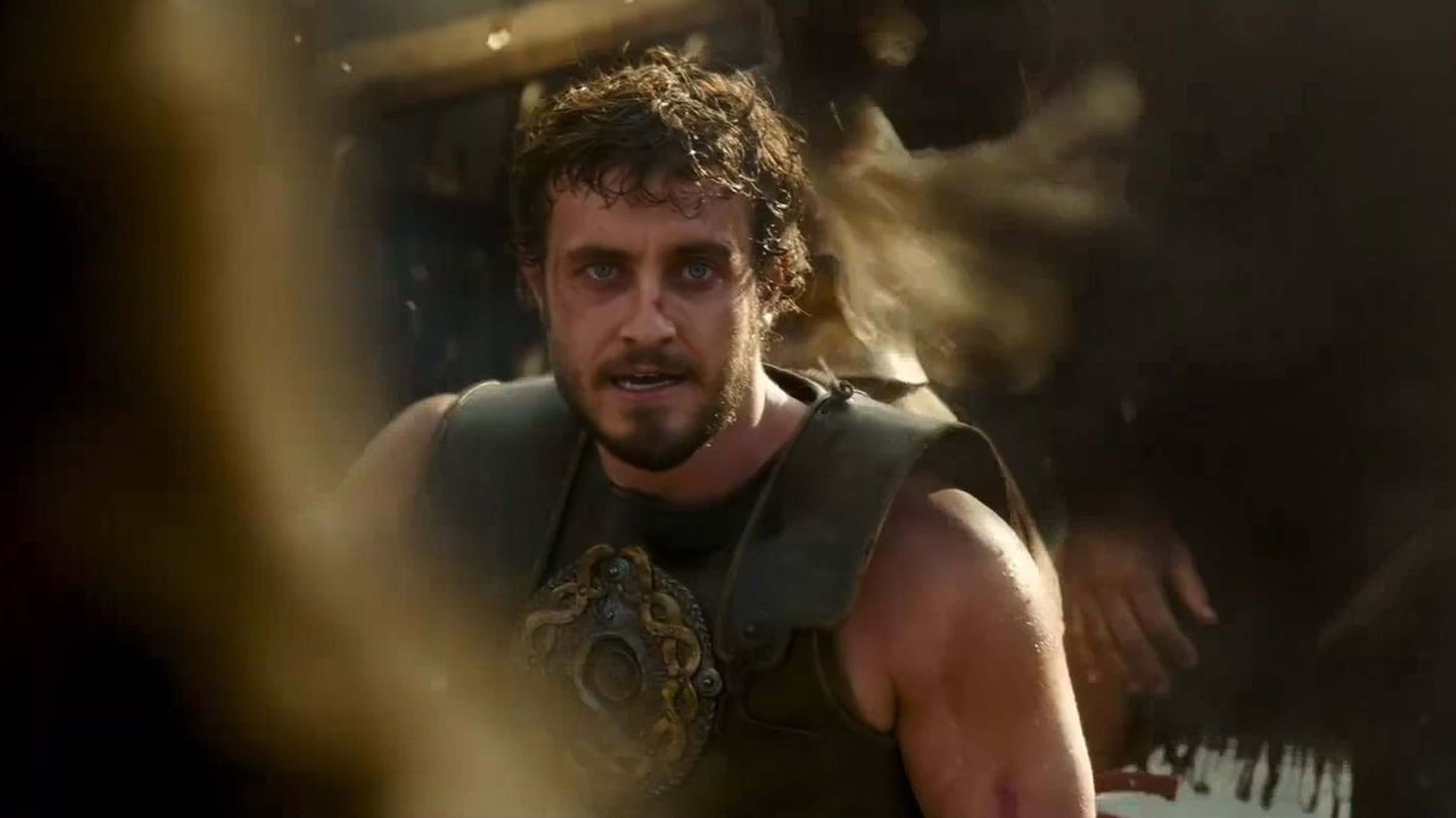 Aaron Taylor-Johnson in a scene from a period film, wearing ancient warrior armor with a decorative chest plate