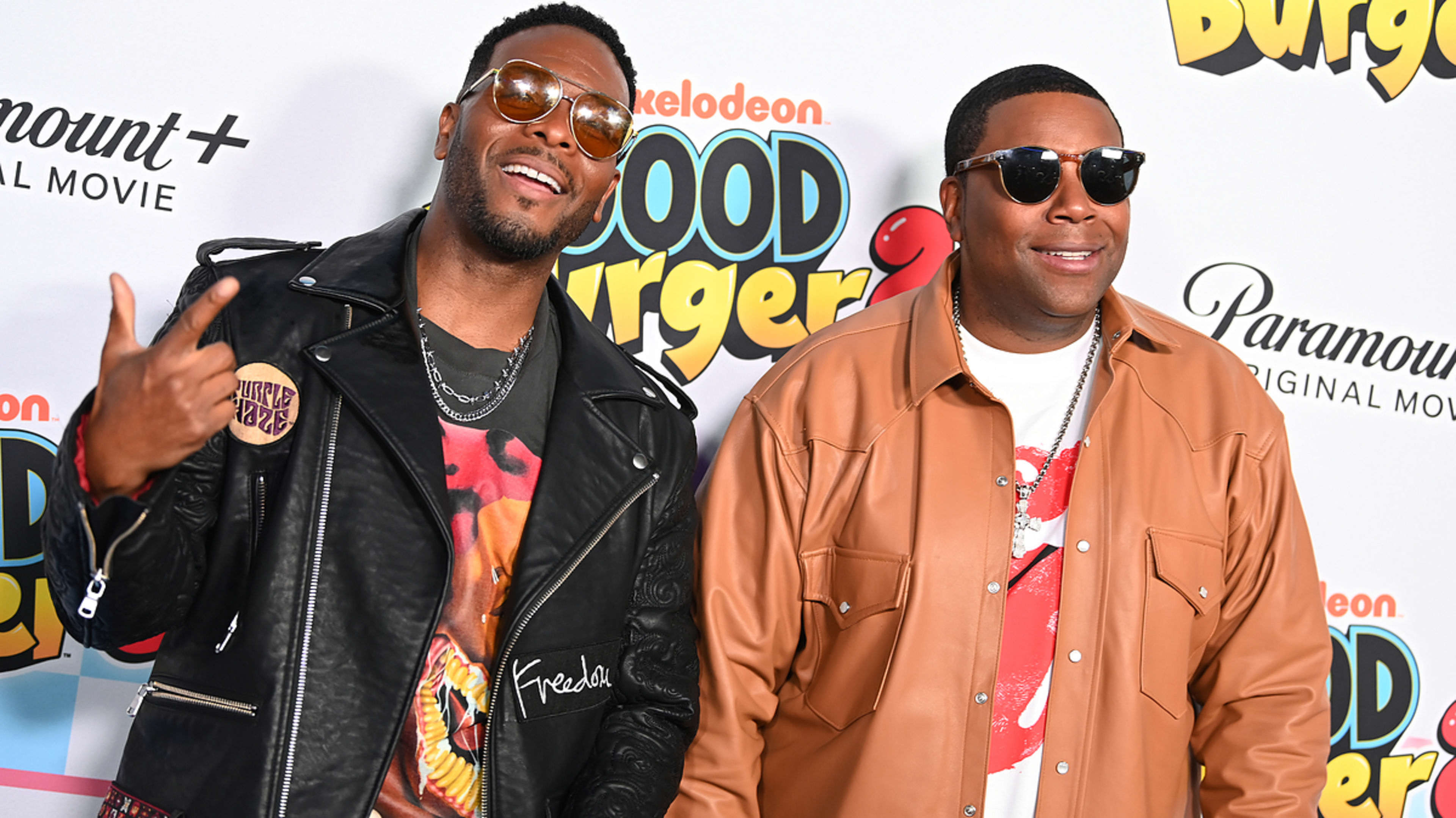 Two actors from 'Good Burger' wearing leather jackets at a promotional event