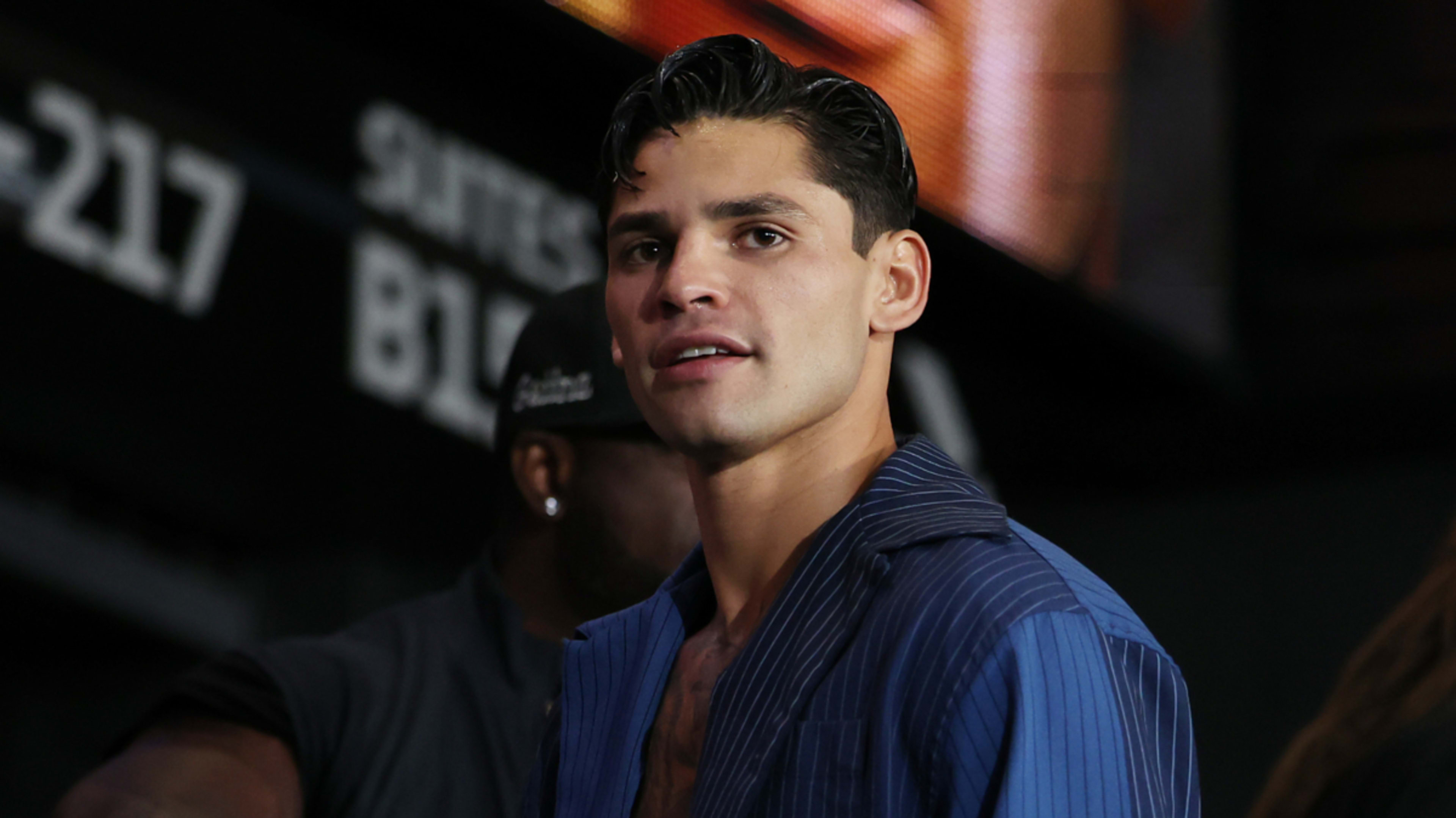 Man in a striped suit jacket at an event