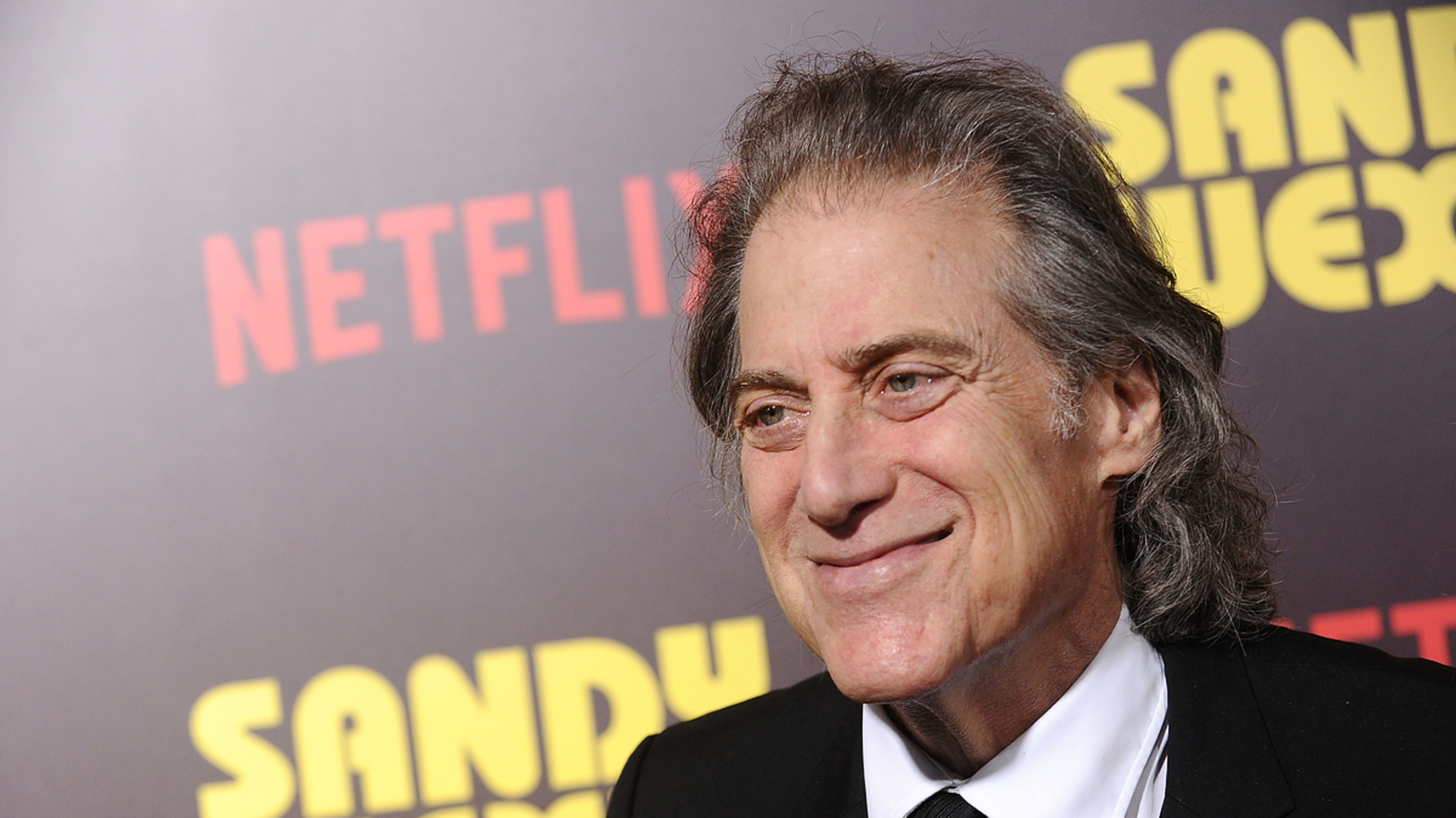 Richard Lewis in a black suit on the red carpet at the 'Sandy Wexler' premiere