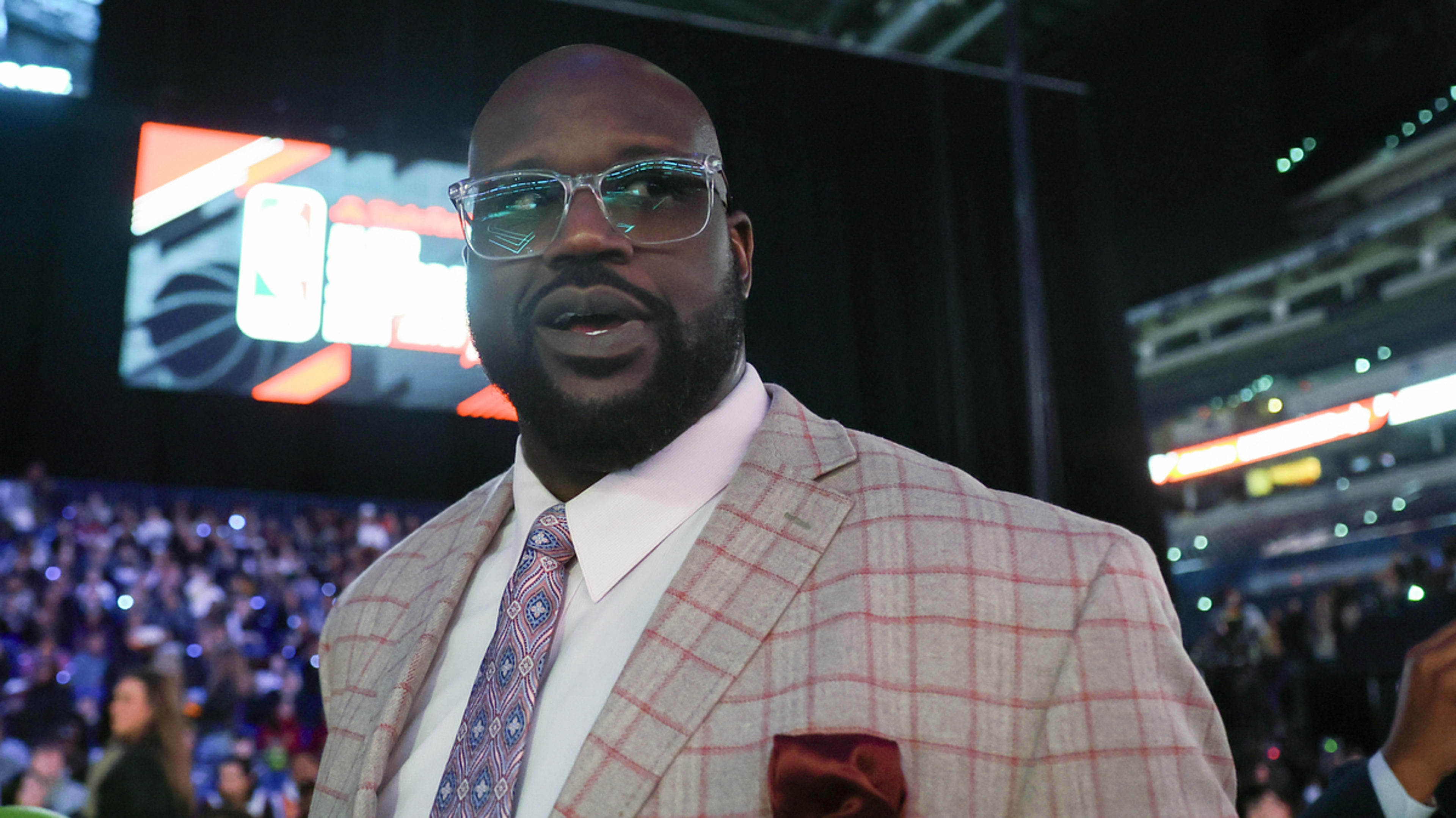 Man in a plaid suit attending a sports event