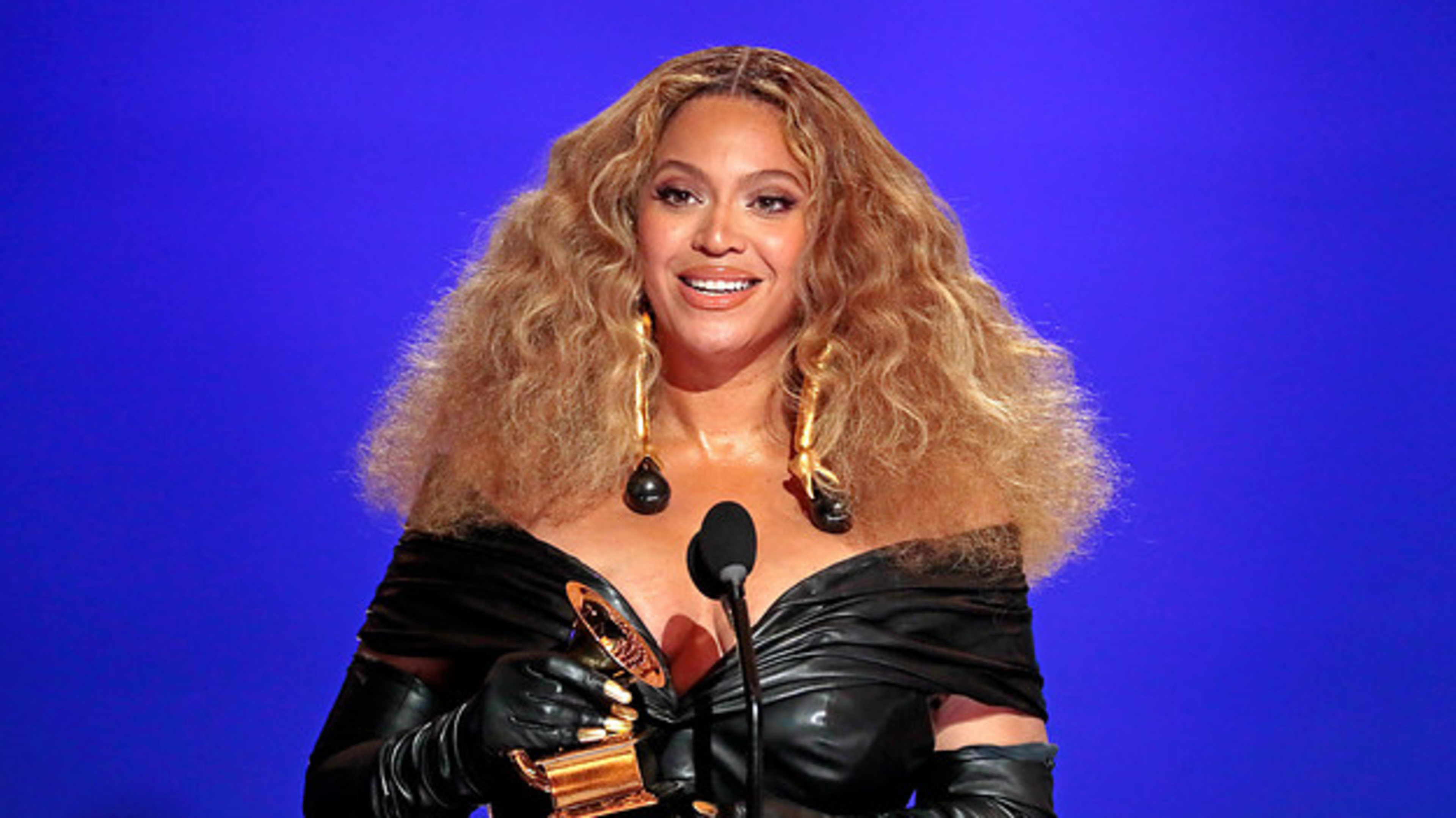 Beyoncé holding a Grammy during the 2021 Grammy Awards ceremony