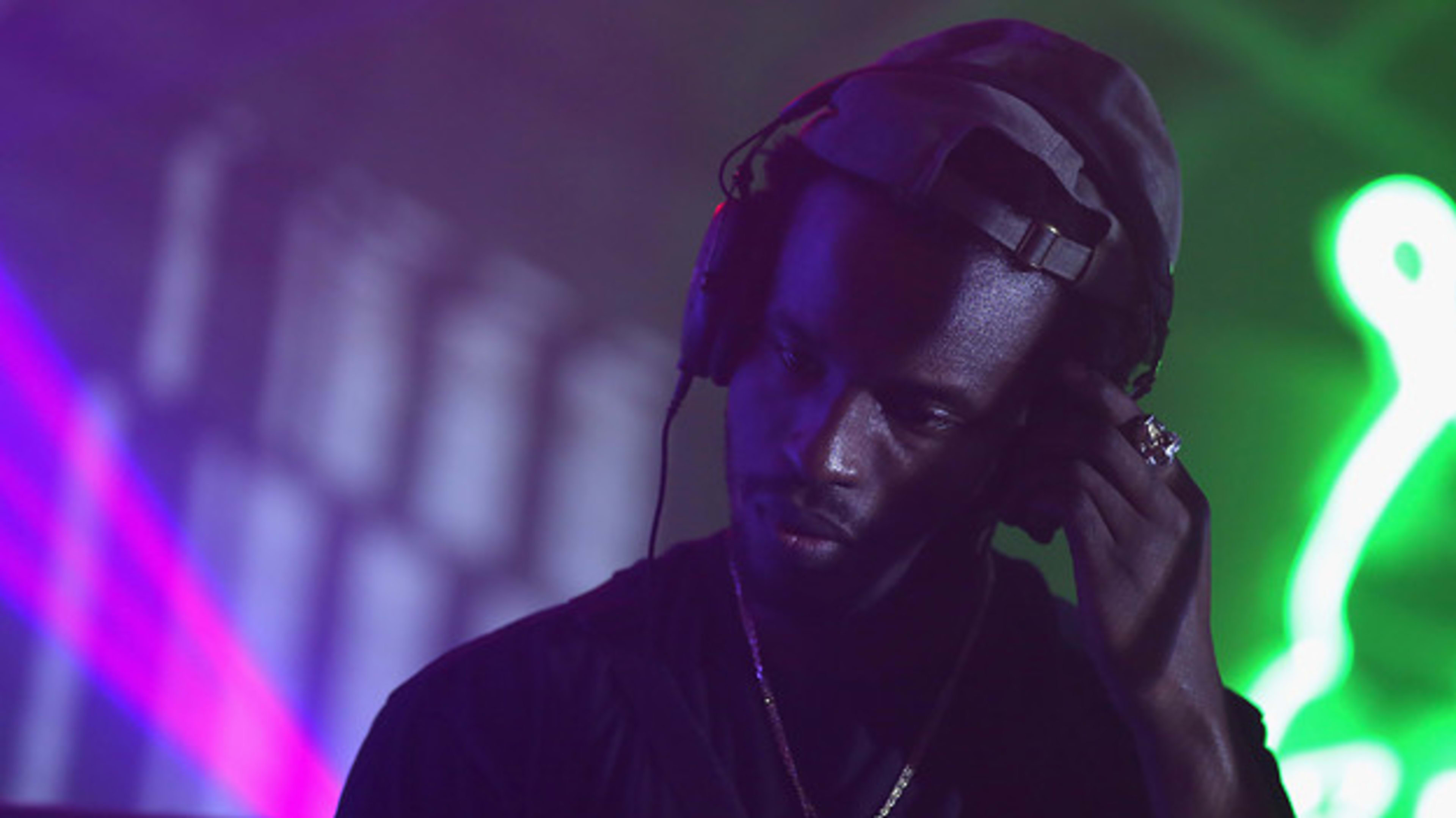 DJ Dahi performs onstage during an adidas event