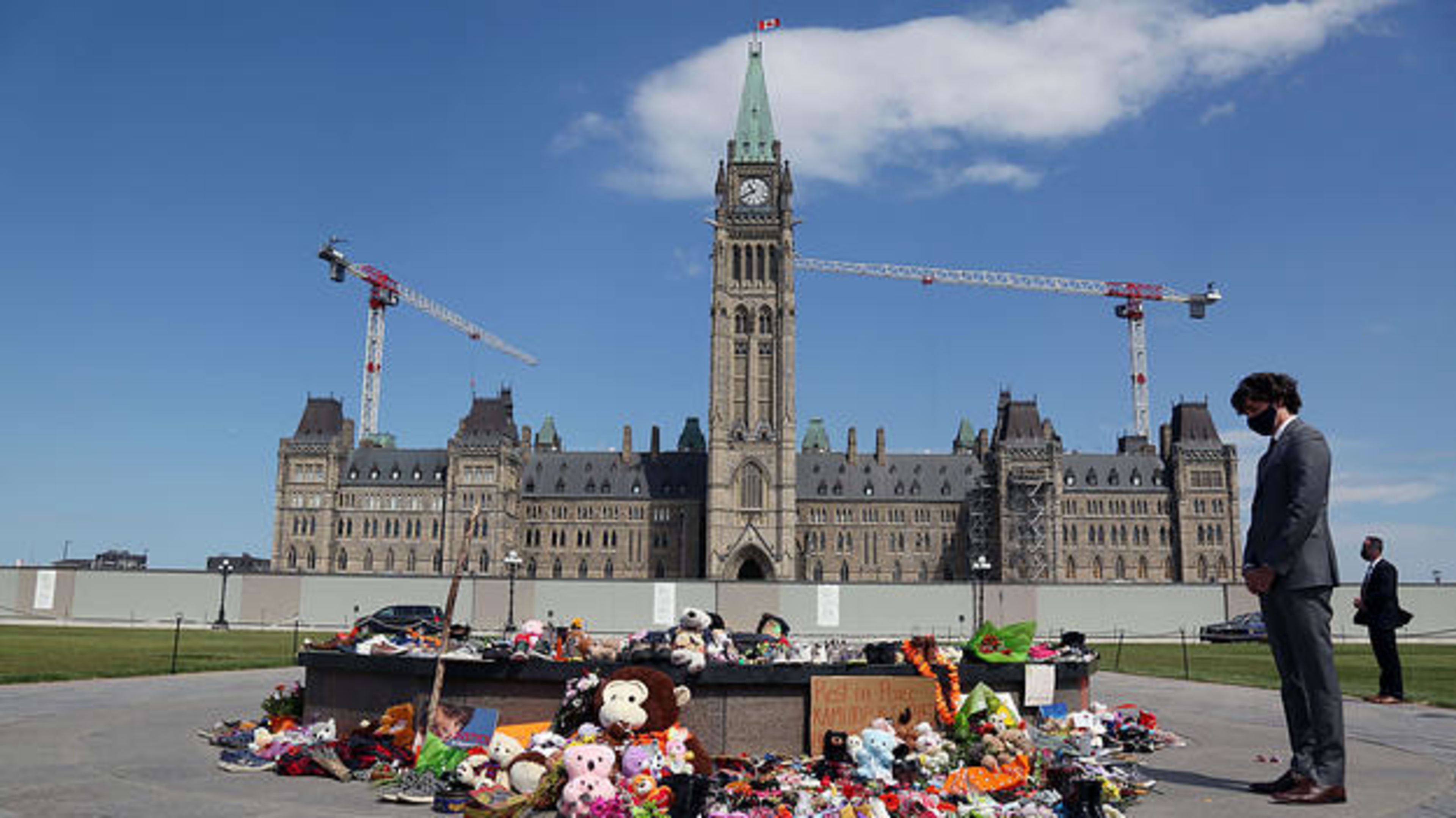 Canadian Prime Minister Justin Trudeau visits the makeshift memorial erected in honor of the 215 indigenous children remains found at a boarding school in British Columbia, on Parliament Hill June 1, 2021 in Ottawa.