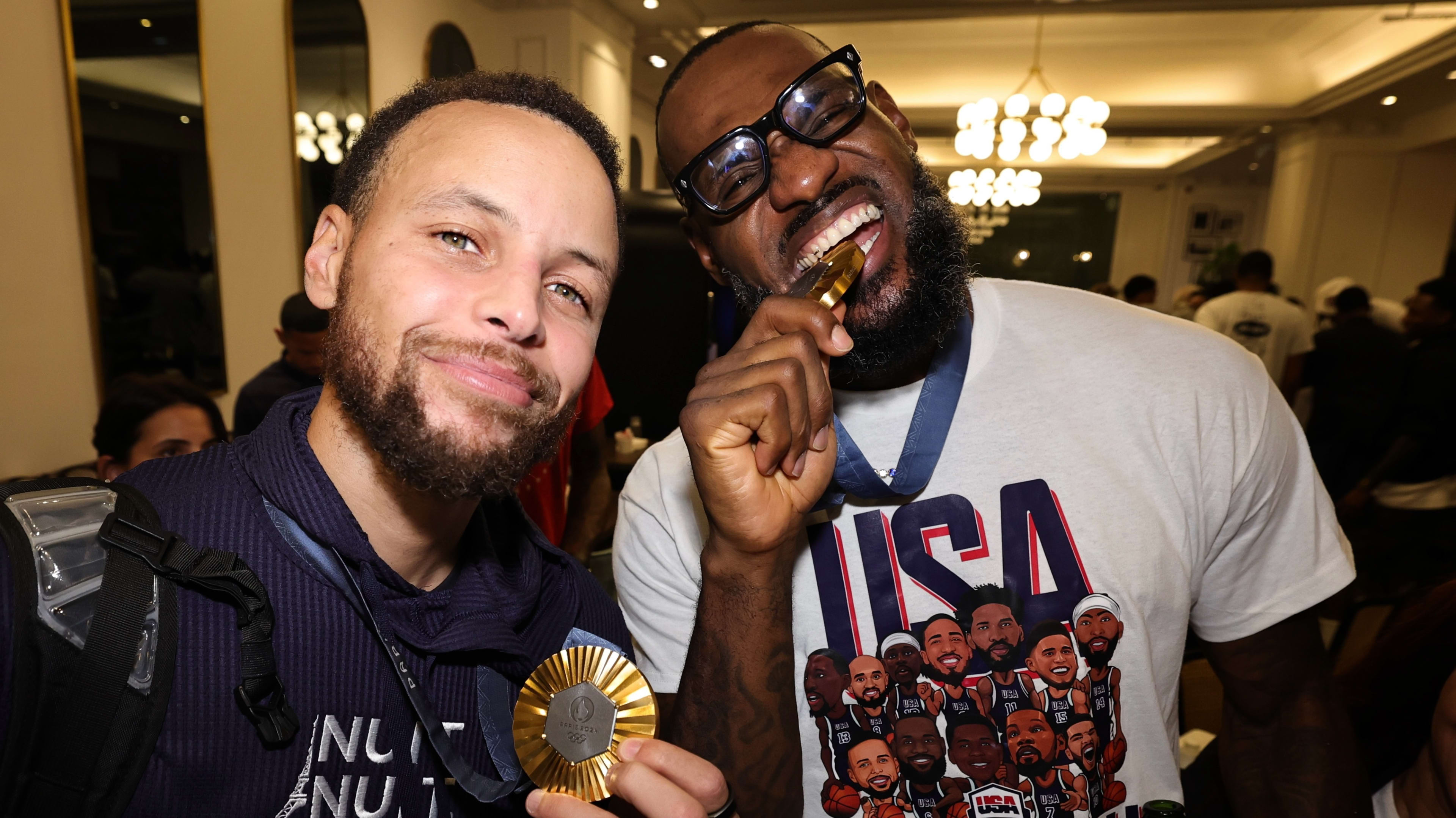 Stephen Curry #4 and LeBron James #6 of the USA Men's National Team returns to the hotel after winning the Gold against France on August 10, 2024 in Paris, France. 