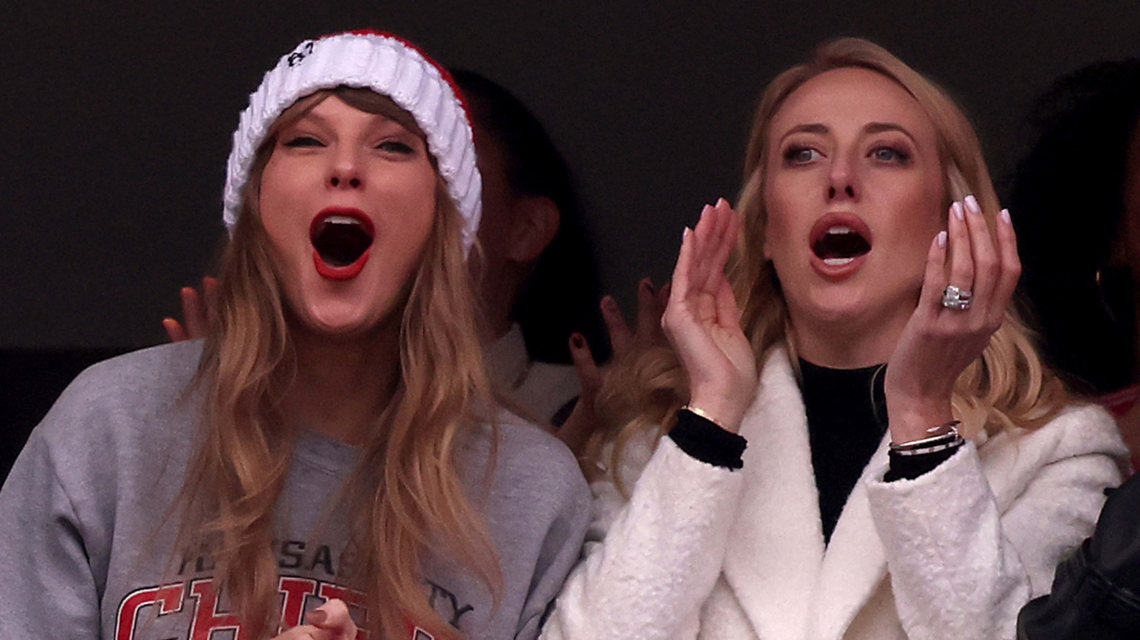 Taylor Swift and Brittany Mahomes attending a game.