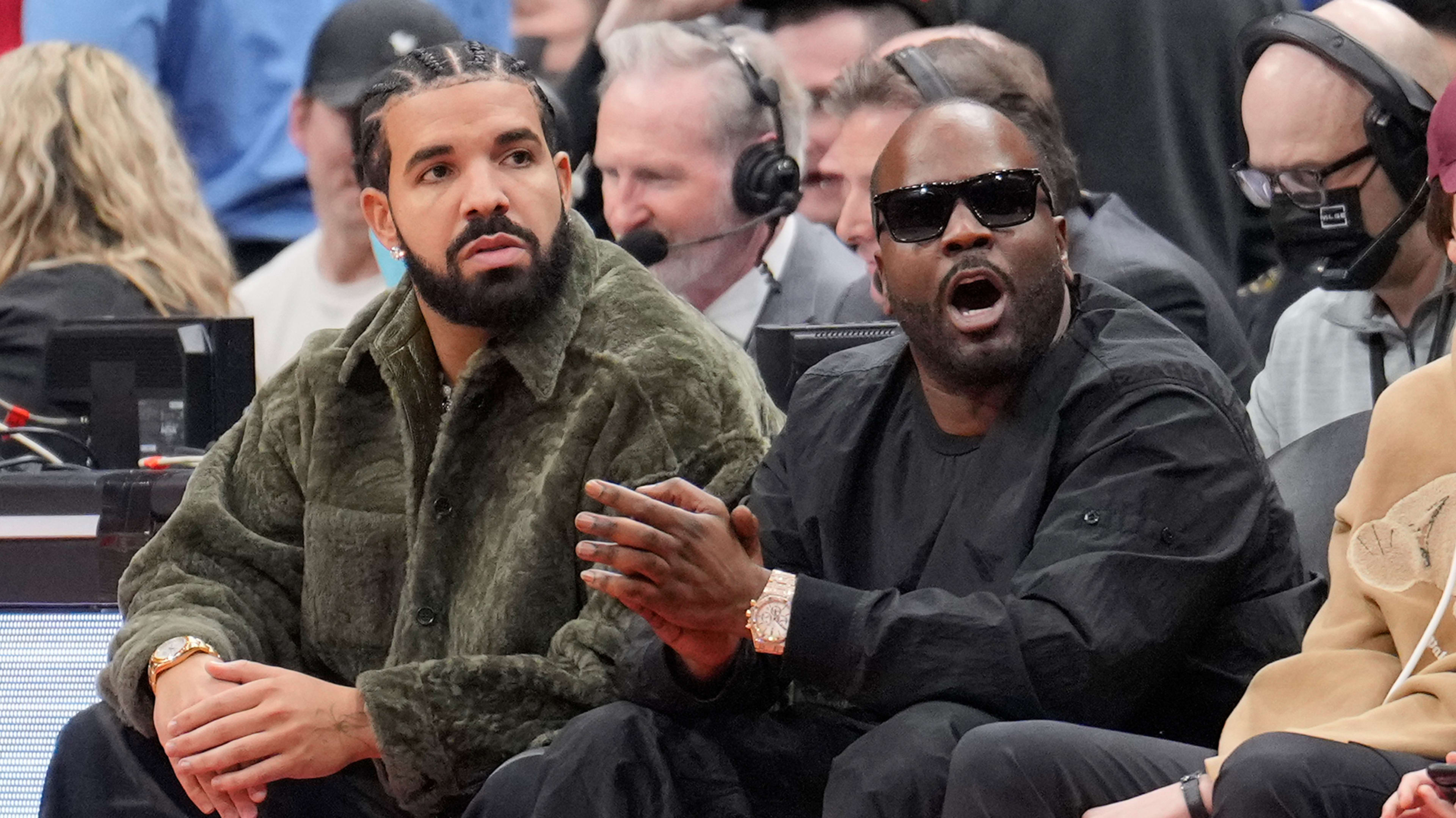 Drake sits with Baka Not Nice during a Raptors and Rockets game.