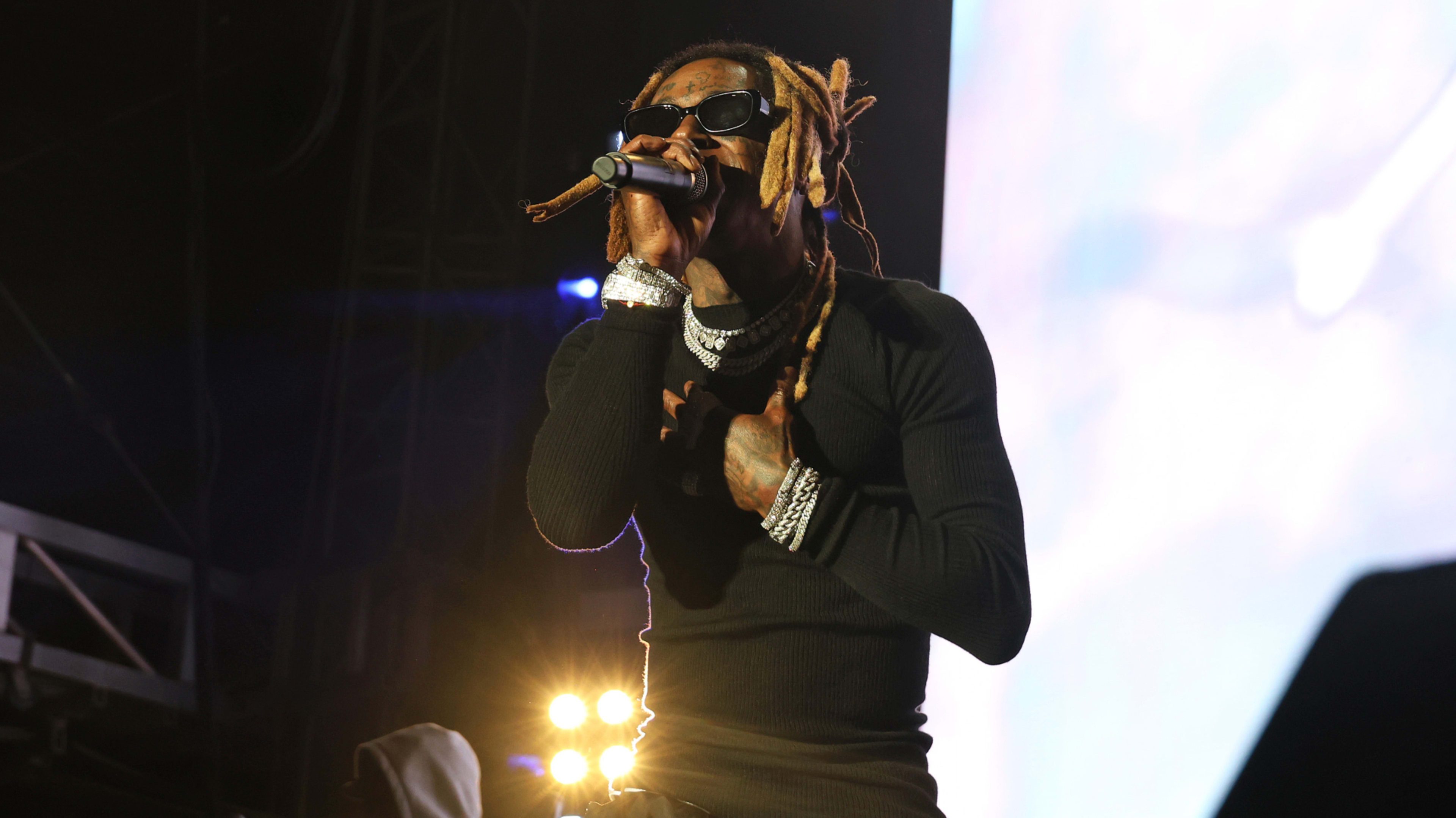 weezy performing live with sunglasses on