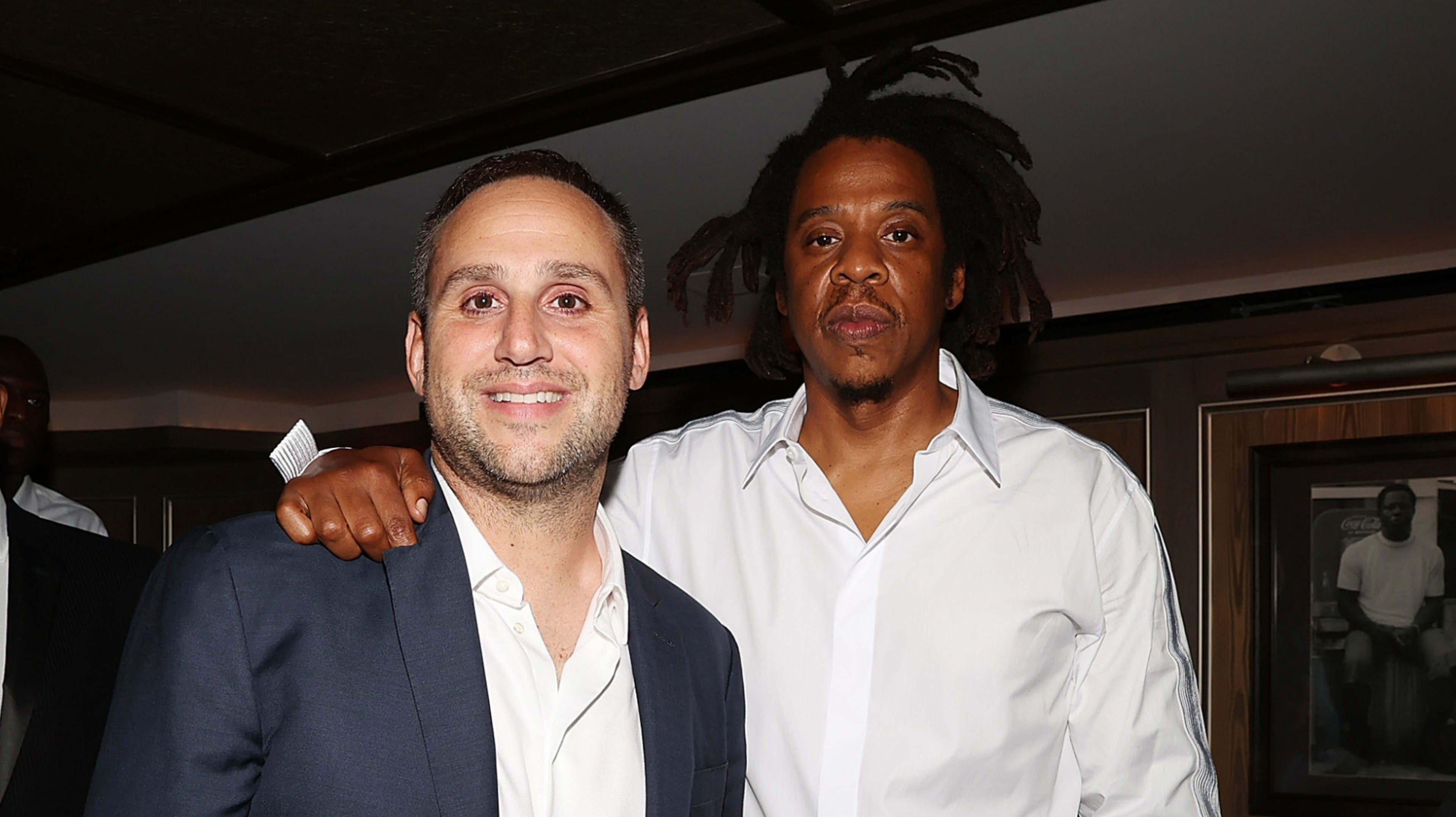 Michael Rubin and Jay-Z attending an event.