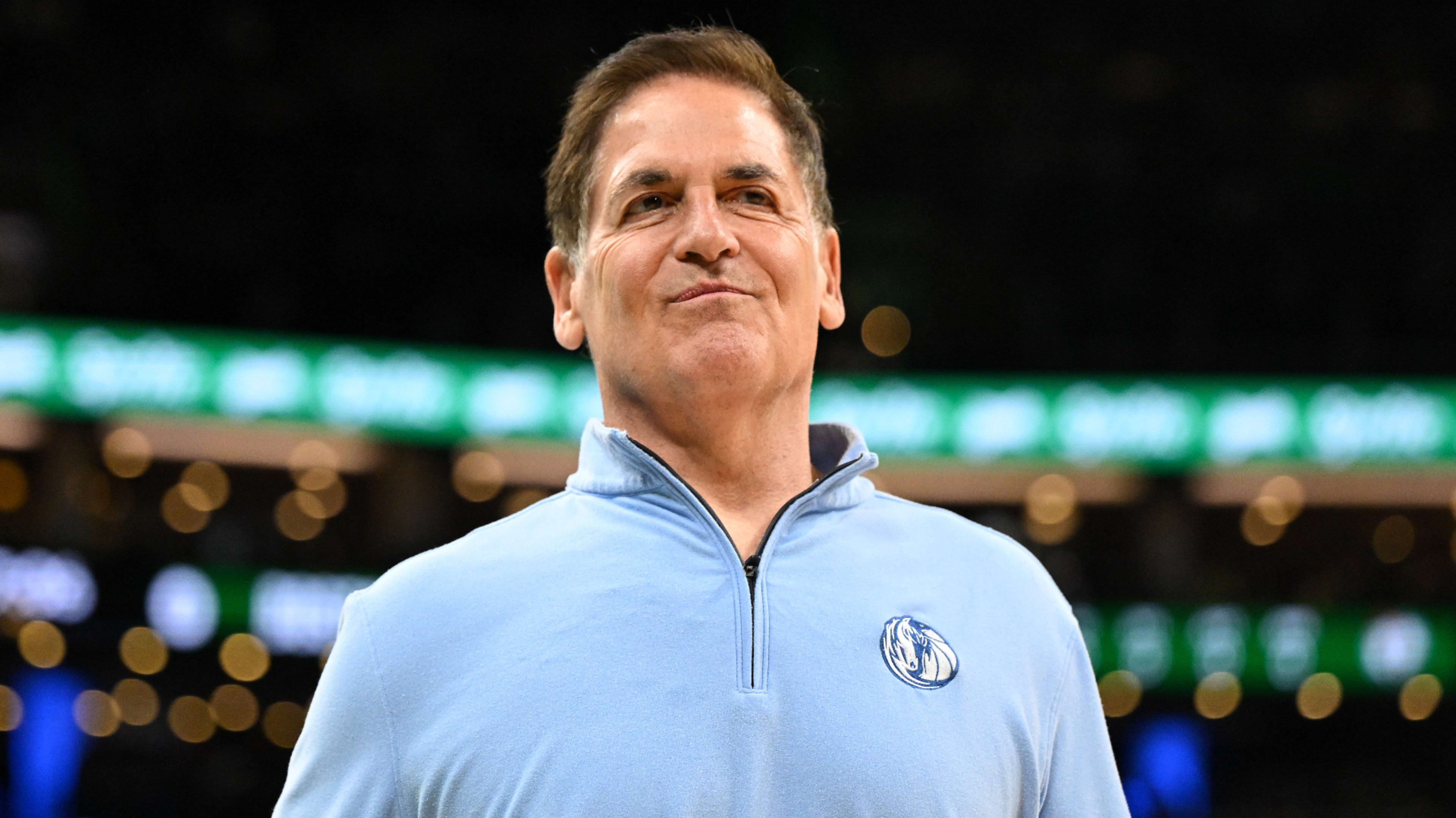 Mark Cuban walks onto the court before a game against the Boston Celtics.