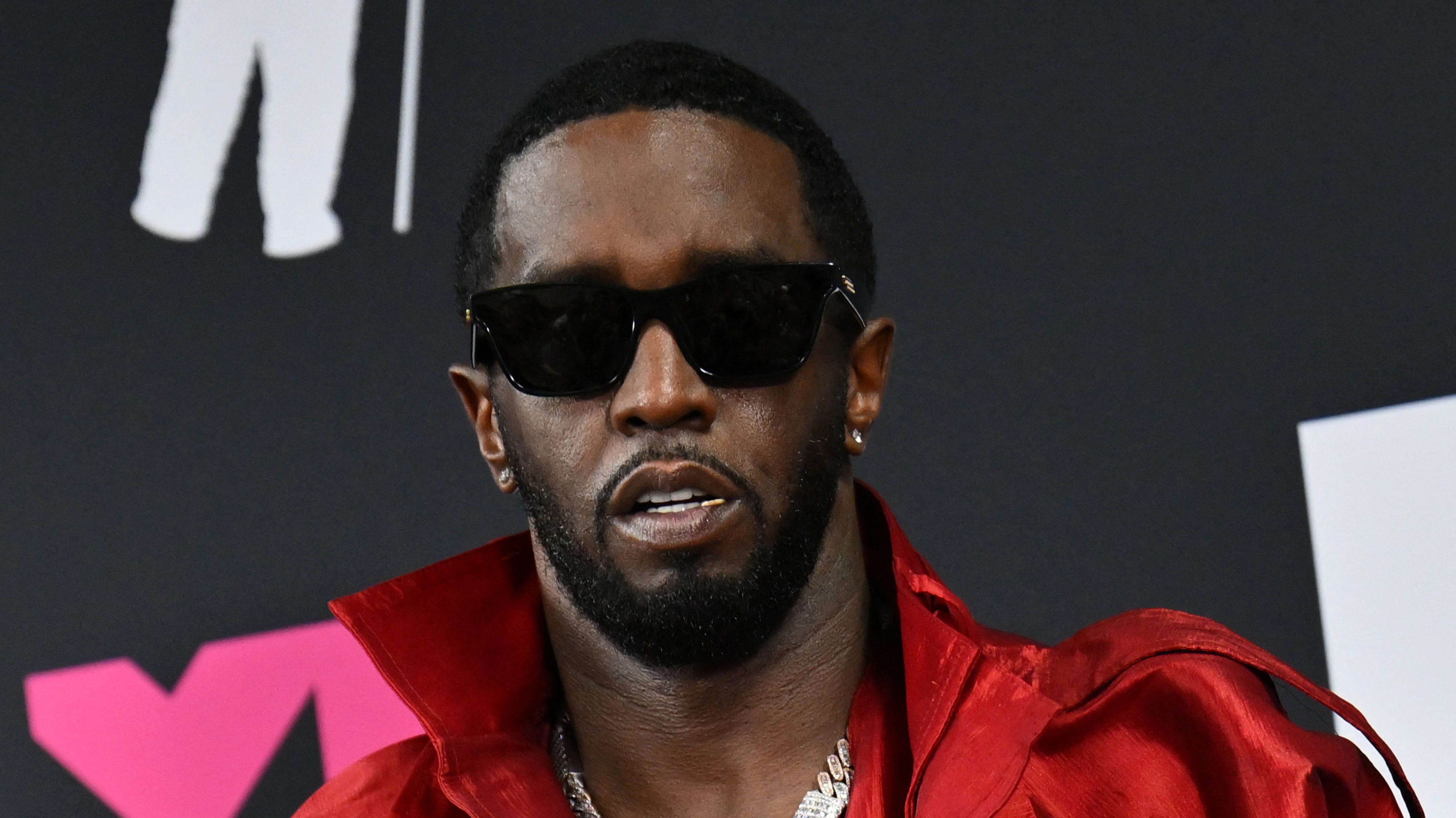 US producer-musician Sean "Diddy" Combs poses with the Global Icon award in the press room during the MTV Video Music Awards at the Prudential Center in Newark, New Jersey, on September 12, 2023.