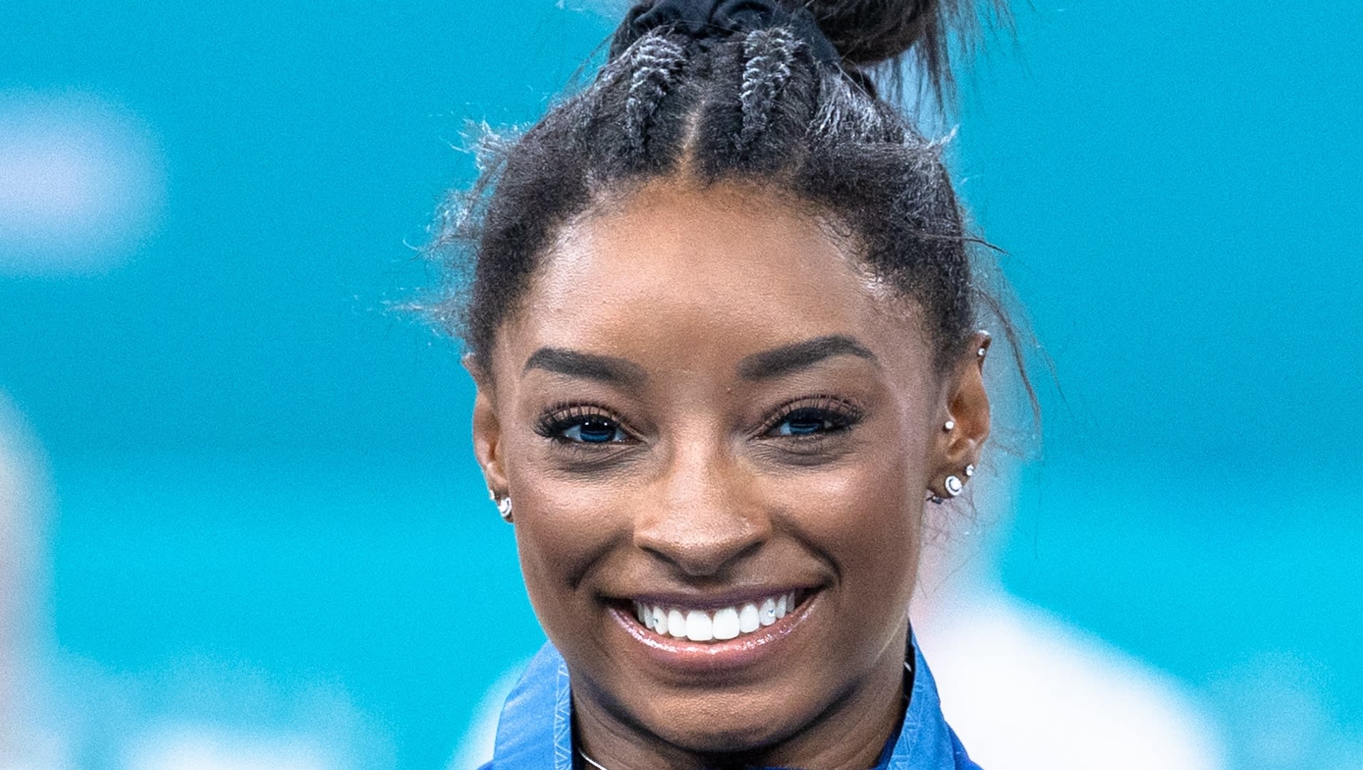 Simone Biles smiling at the camera