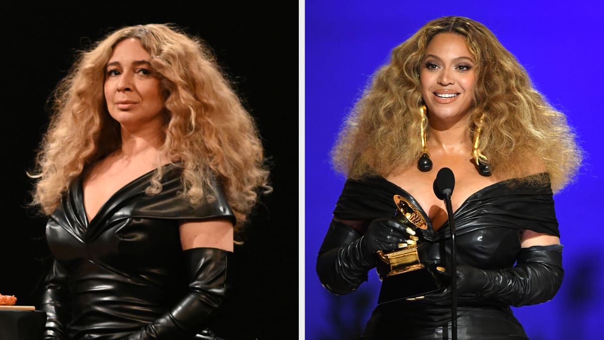 Maya Rudolph and Beyoncé wearing black leather dresses with voluminous hair. Maya is on stage looking serious, while Beyoncé is holding a Grammy and smiling at the audience
