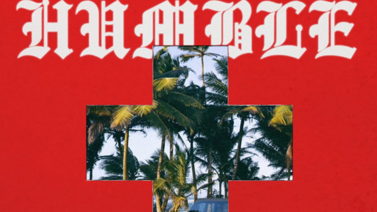 Album cover with the title "HUMBLE" in gothic font, featuring a cross-shaped cutout with a tropical background and a jeep. Artist: SAINt JHN