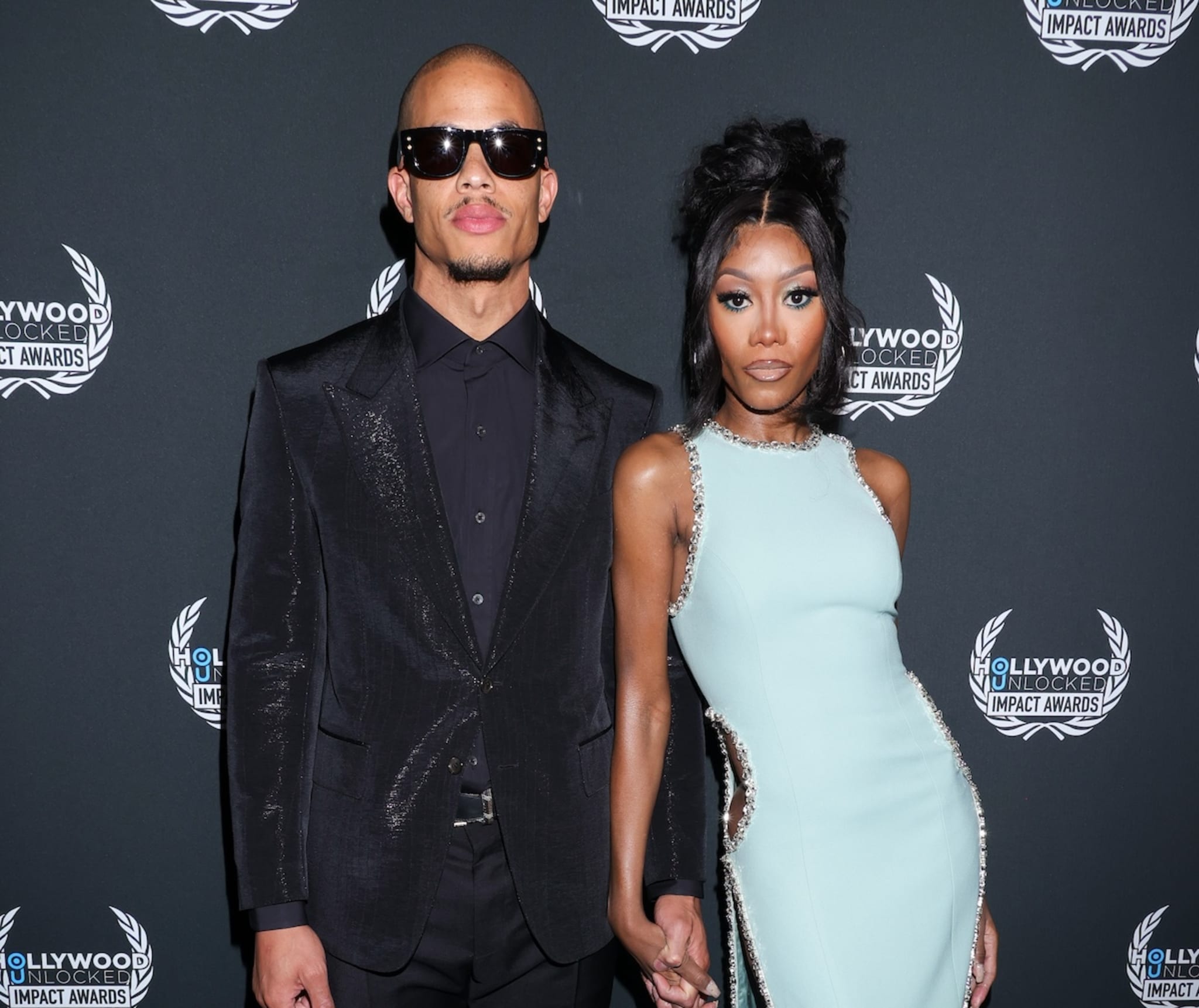 BEVERLY HILLS, CALIFORNIA - JUNE 27: (L-R) Raysean Hairston and Muni Long attend the 3rd Annual Hollywood Unlocked Impact Awards at The Beverly Hilton on June 27, 2023 in Beverly Hills, California.