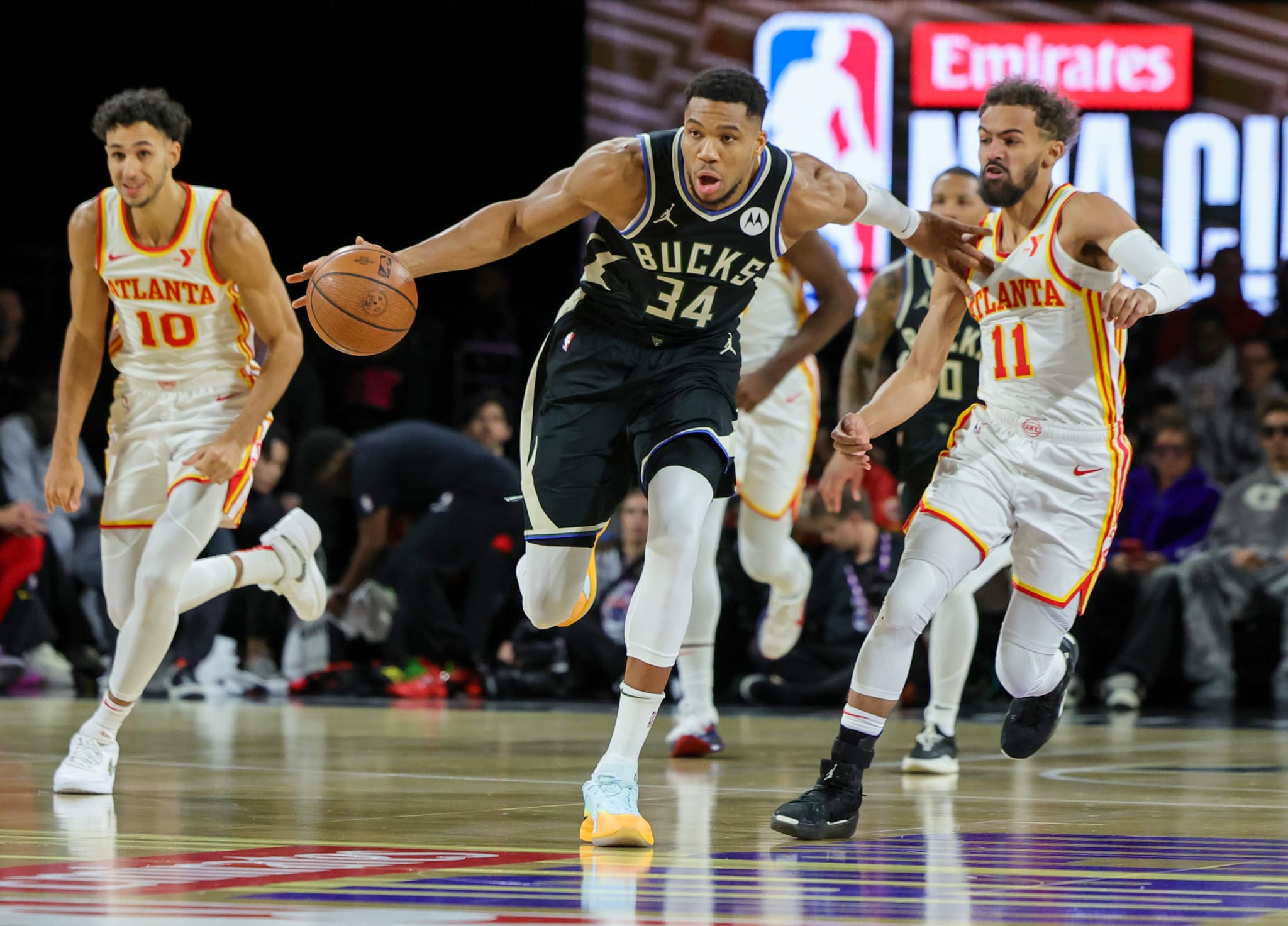 Atlanta Hawks v Milwaukee Bucks: Giannis Antetokounmpo #34 of the Milwaukee Bucks brings the ball up the court against Trae Young #11 of the Atlanta Hawks.