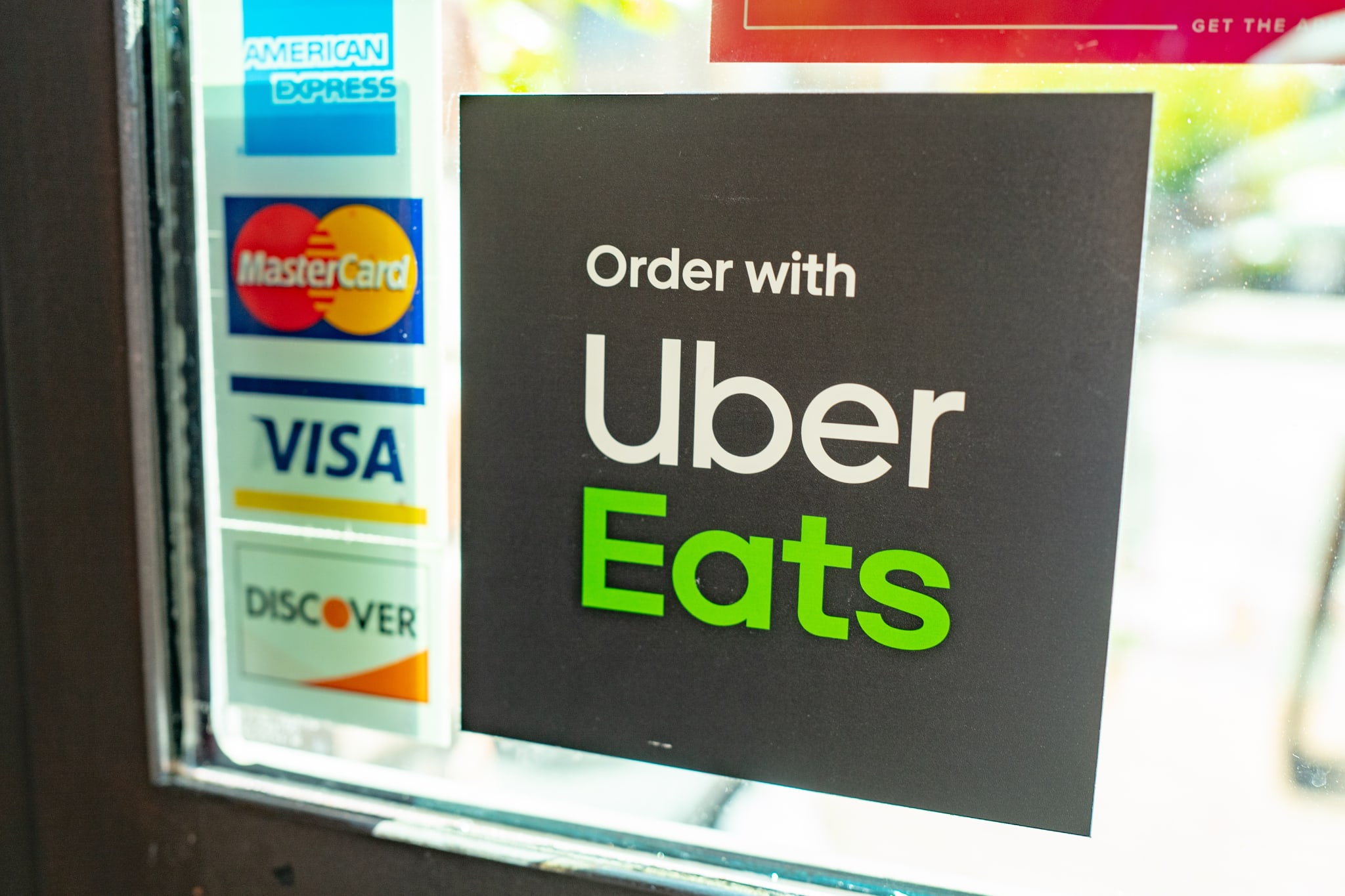 uber eats sign on window outside