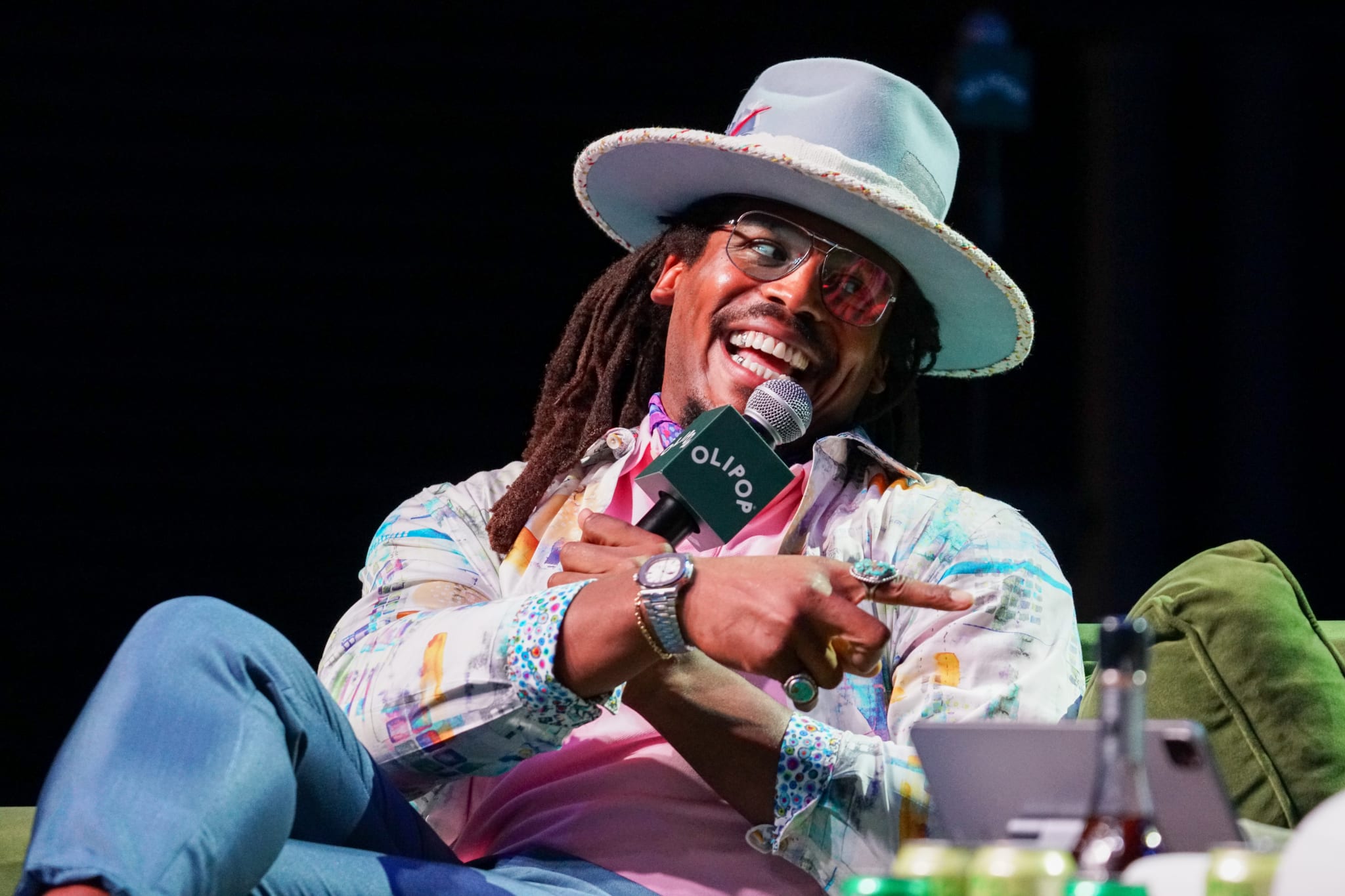 ATLANTA, GEORGIA - AUGUST 22: Cam Newton speaks onstage during the Nightcap Summer Sessions at Buckhead Theatre on August 22, 2024 in Atlanta, Georgia.
