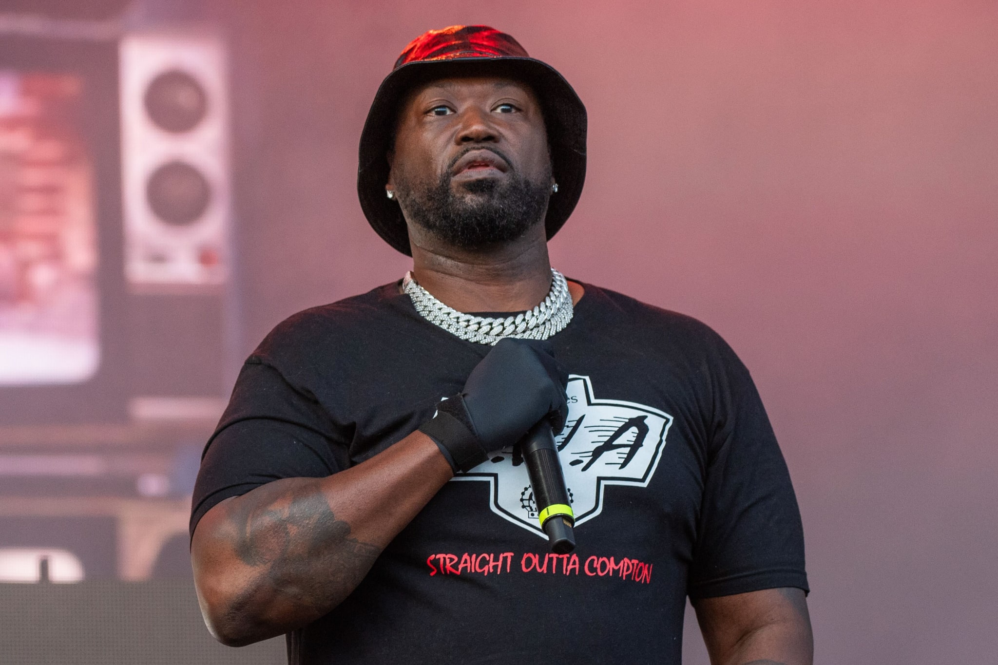 Project Pat holding a mic