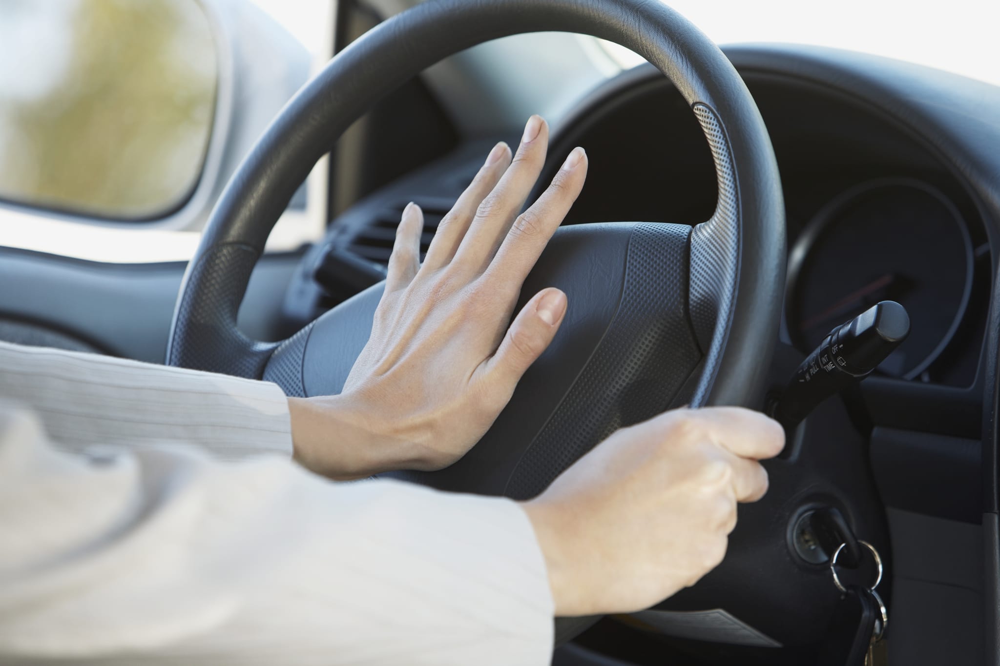 person honking their horn