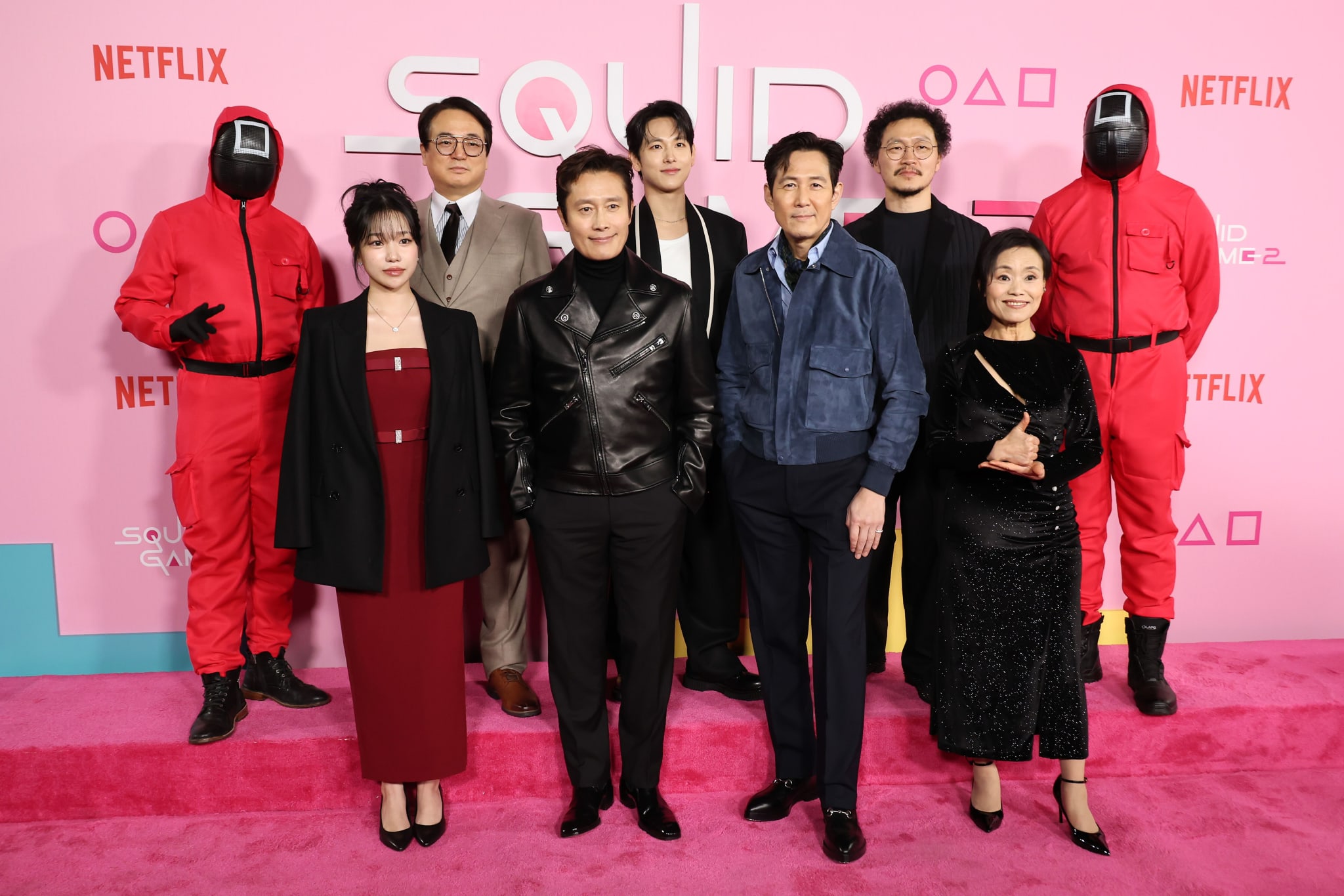 LOS ANGELES, CALIFORNIA - DECEMBER 12: (L-R) Jo Yu-ri, Lee Seo-hwan, Lee Byung-hun, Yim Si-wan, Lee Jung-jae, Yang Dong-geun and Kang Ae-shim attend the Los Angeles Premiere & Fan Event for Netflix's "Squid Game" Season 2 at Los Angeles City College on December 12, 2024 in Los Angeles, California.