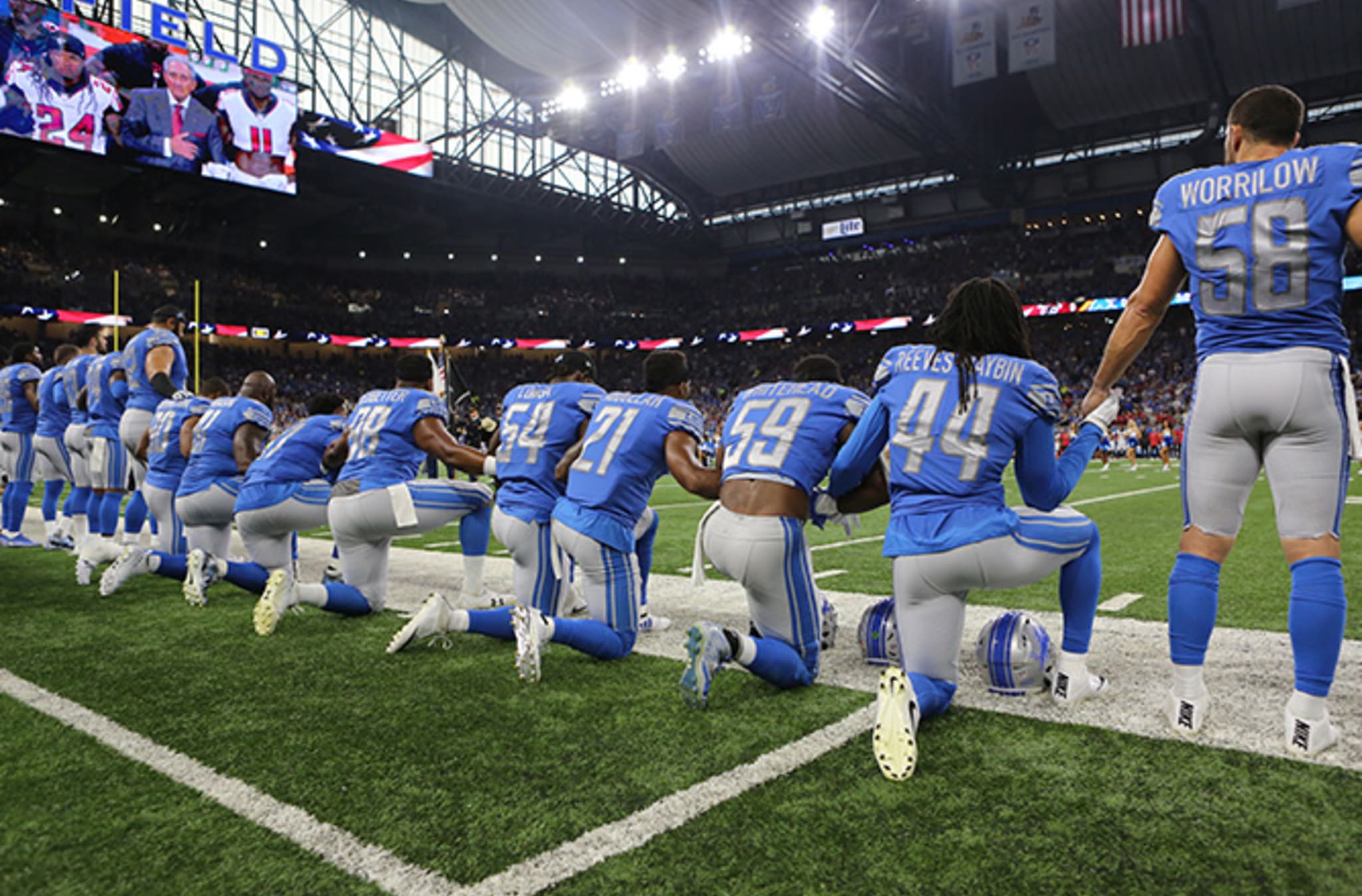 This is a photo of football players kneeling.