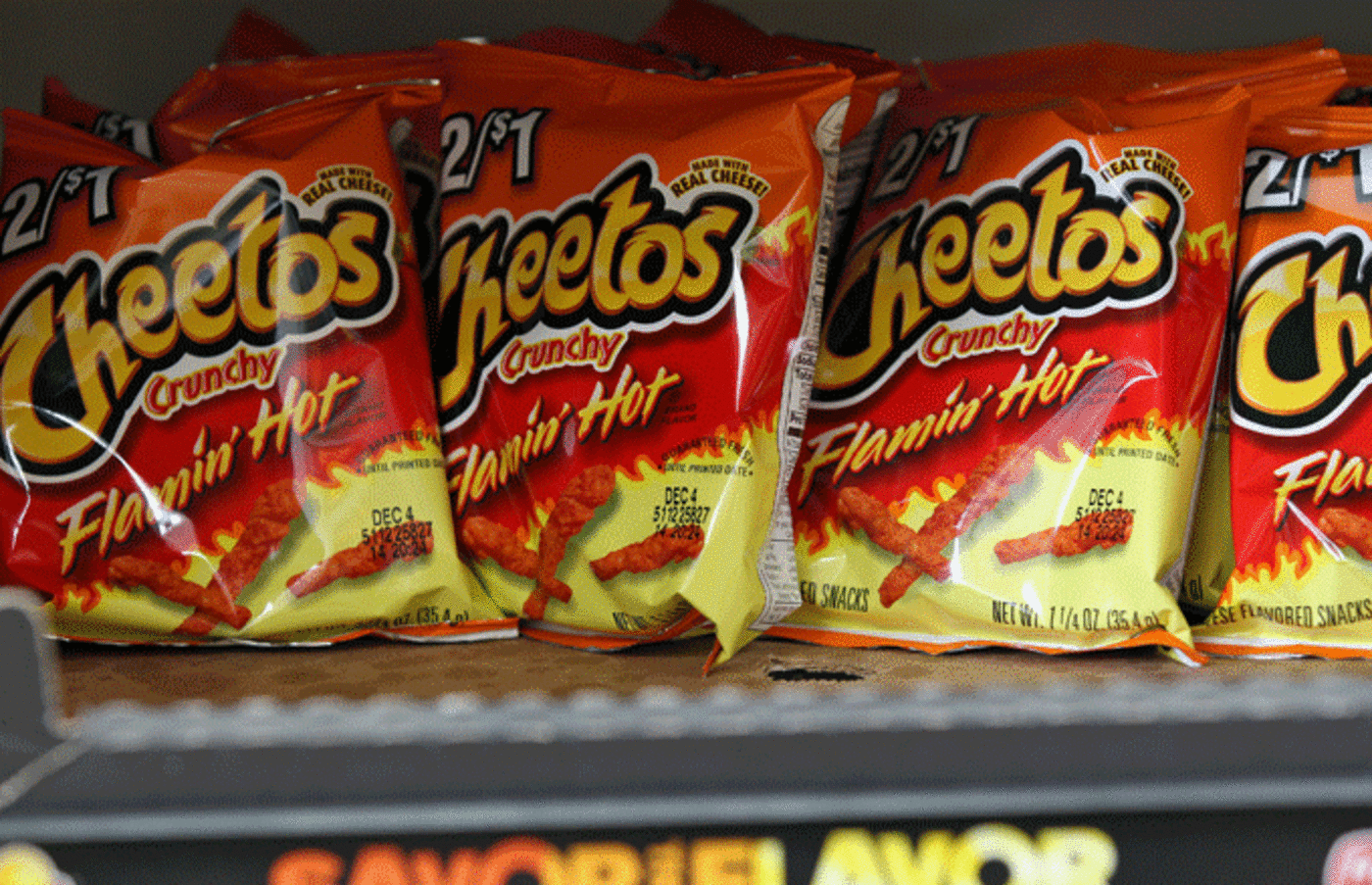 Bags of Flamin' Hot Cheetos sit on store shelves.