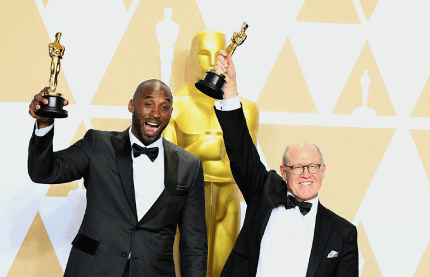 Kobe Bryant and Glen Keane, winners of the Animated Short award for 'Dear Basketball.'