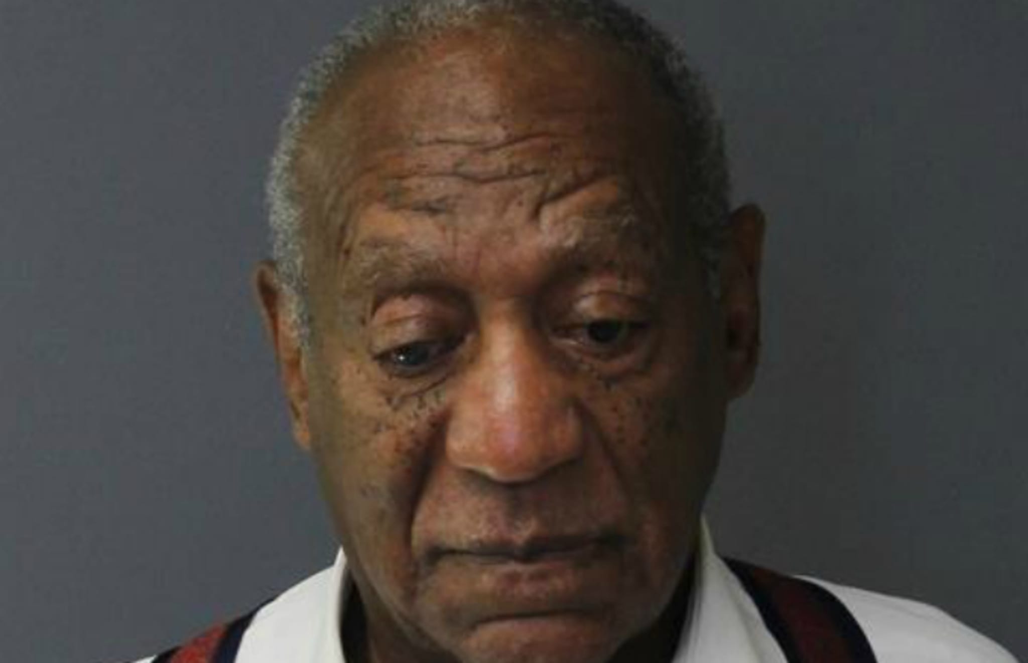Bill Cosby poses for a mugshot