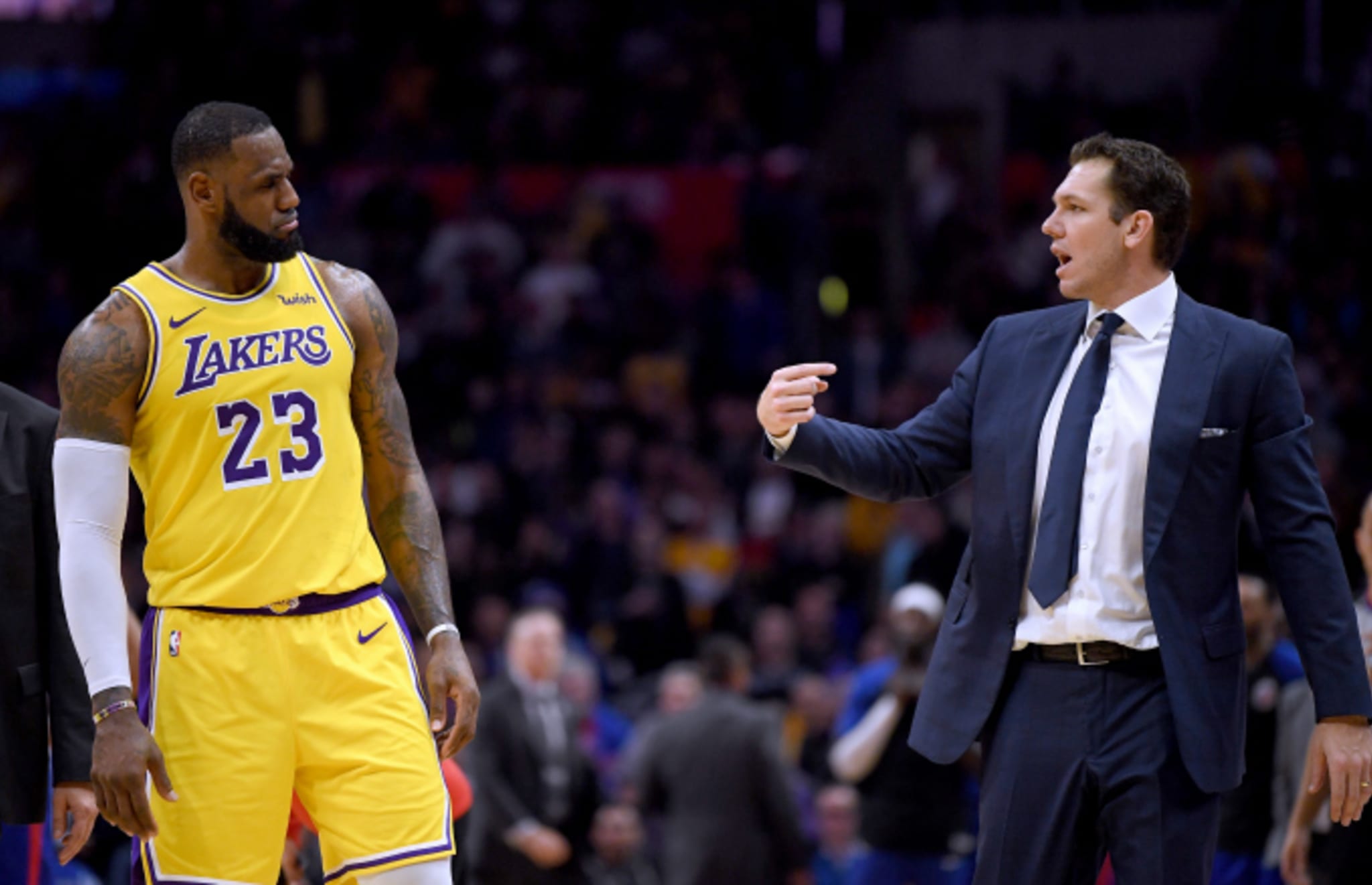 LeBron James #23 of the Los Angeles Lakers and Luke Walton talk