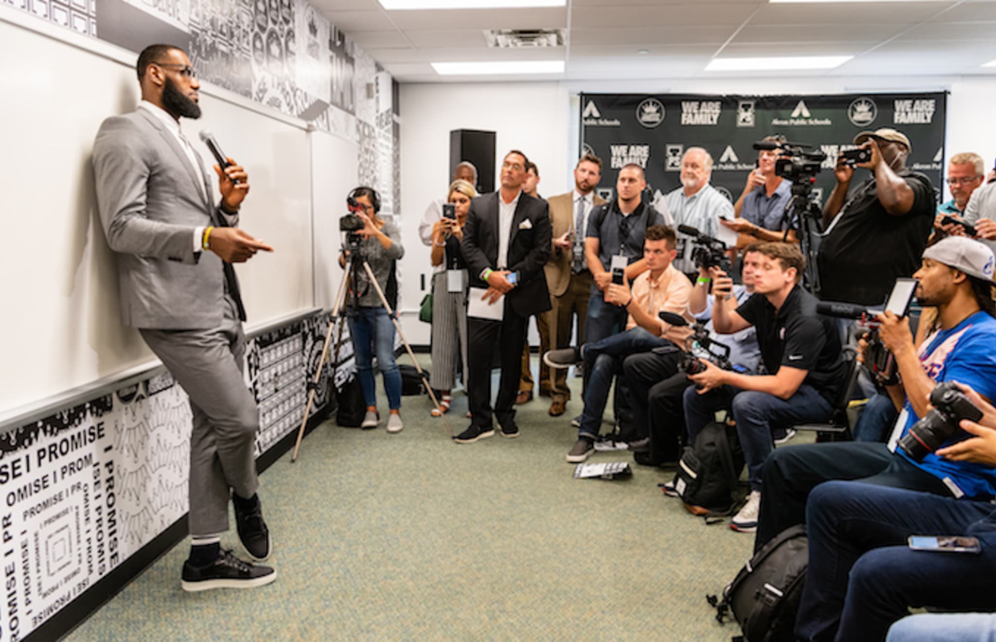 LeBron James addresses the media after the opening ceremonies of the I Promise School.