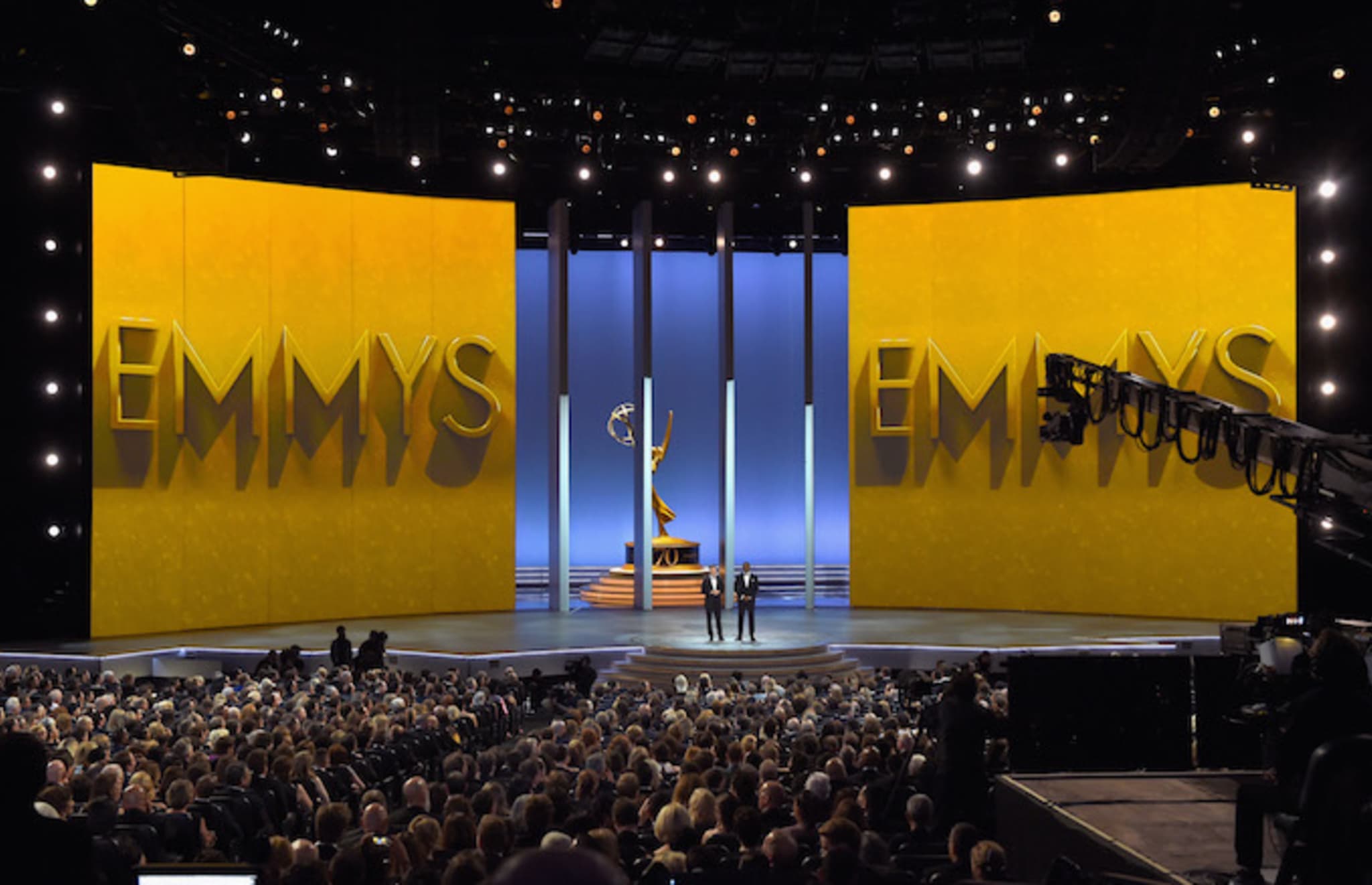 Colin Jost (L) and Michael Che speak onstage during the 70th Emmy Awards.