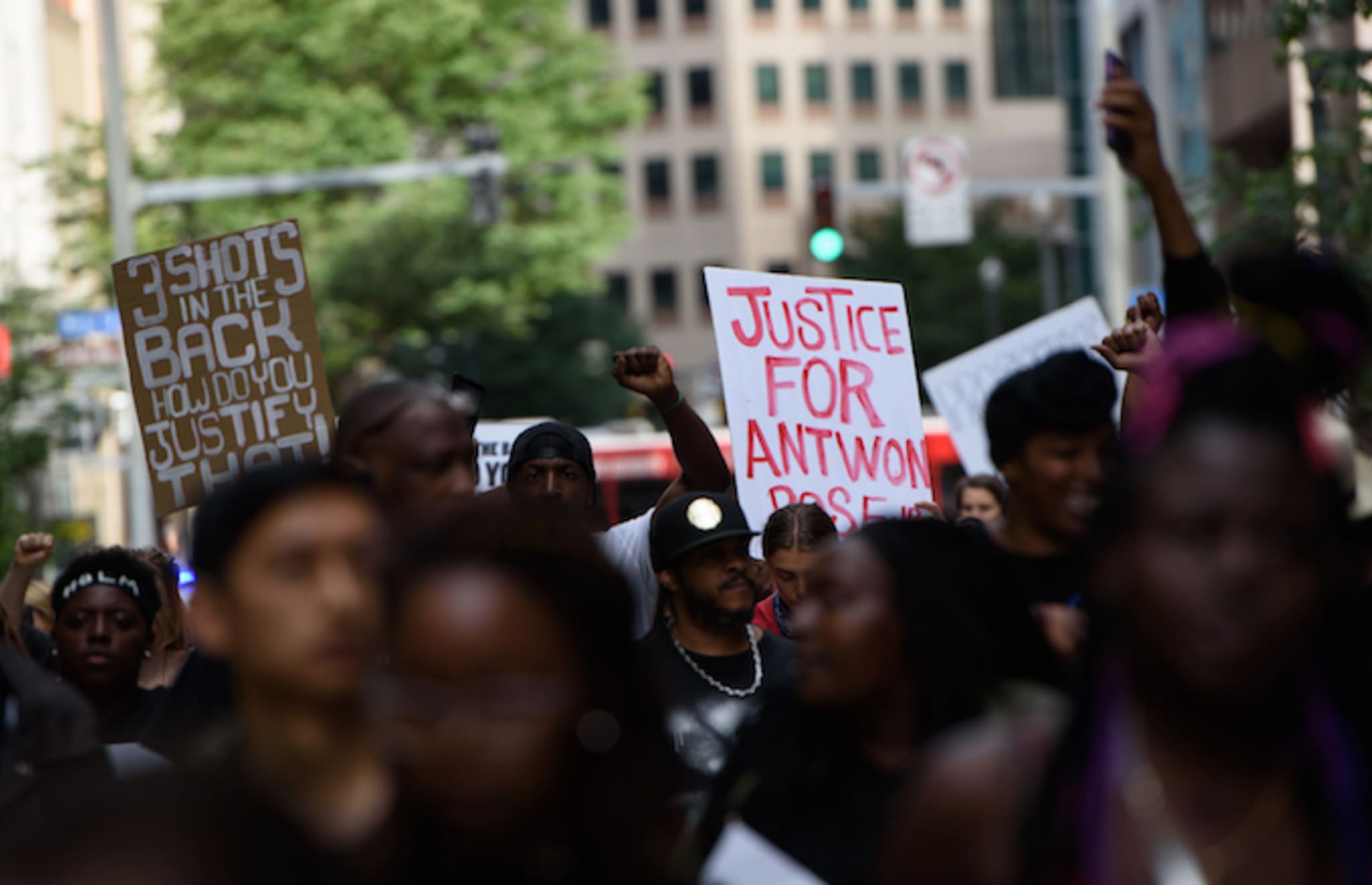 Protestors at a rally asking for justice for Antwon Rose.