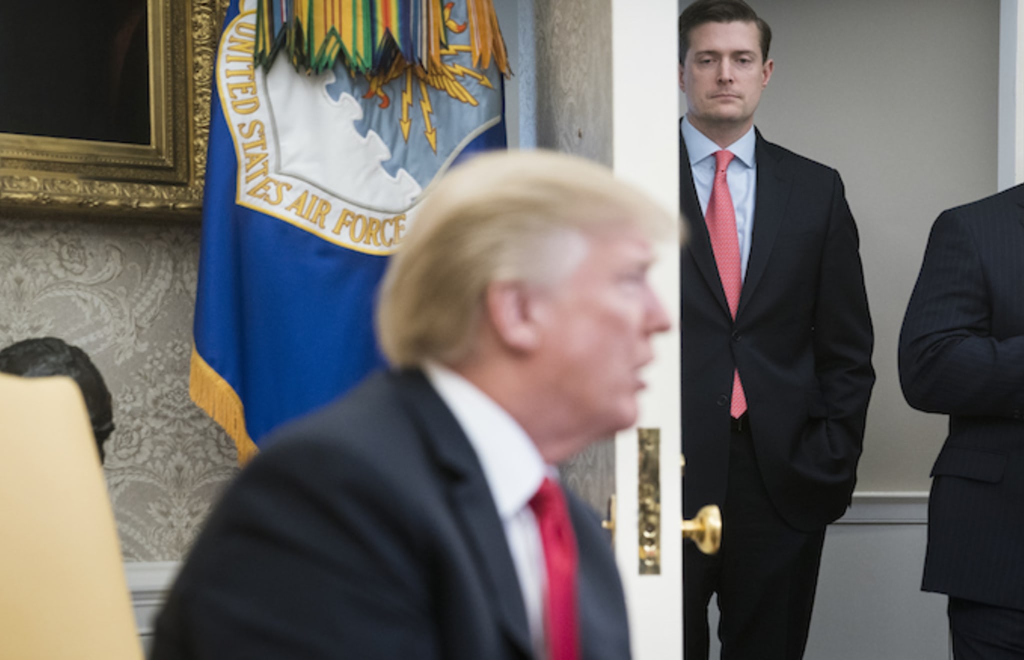 Rob Porter watches Donald Trump.