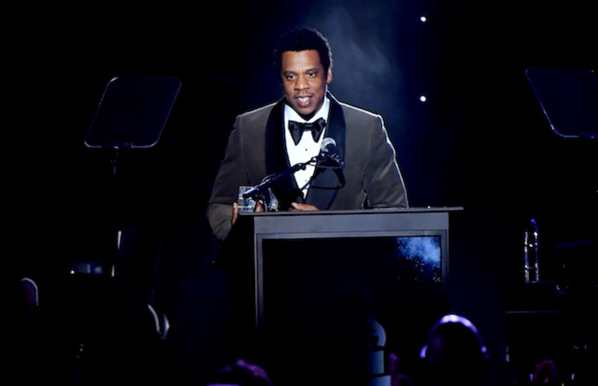Jay Z accepts the President's Merit Award onstage.