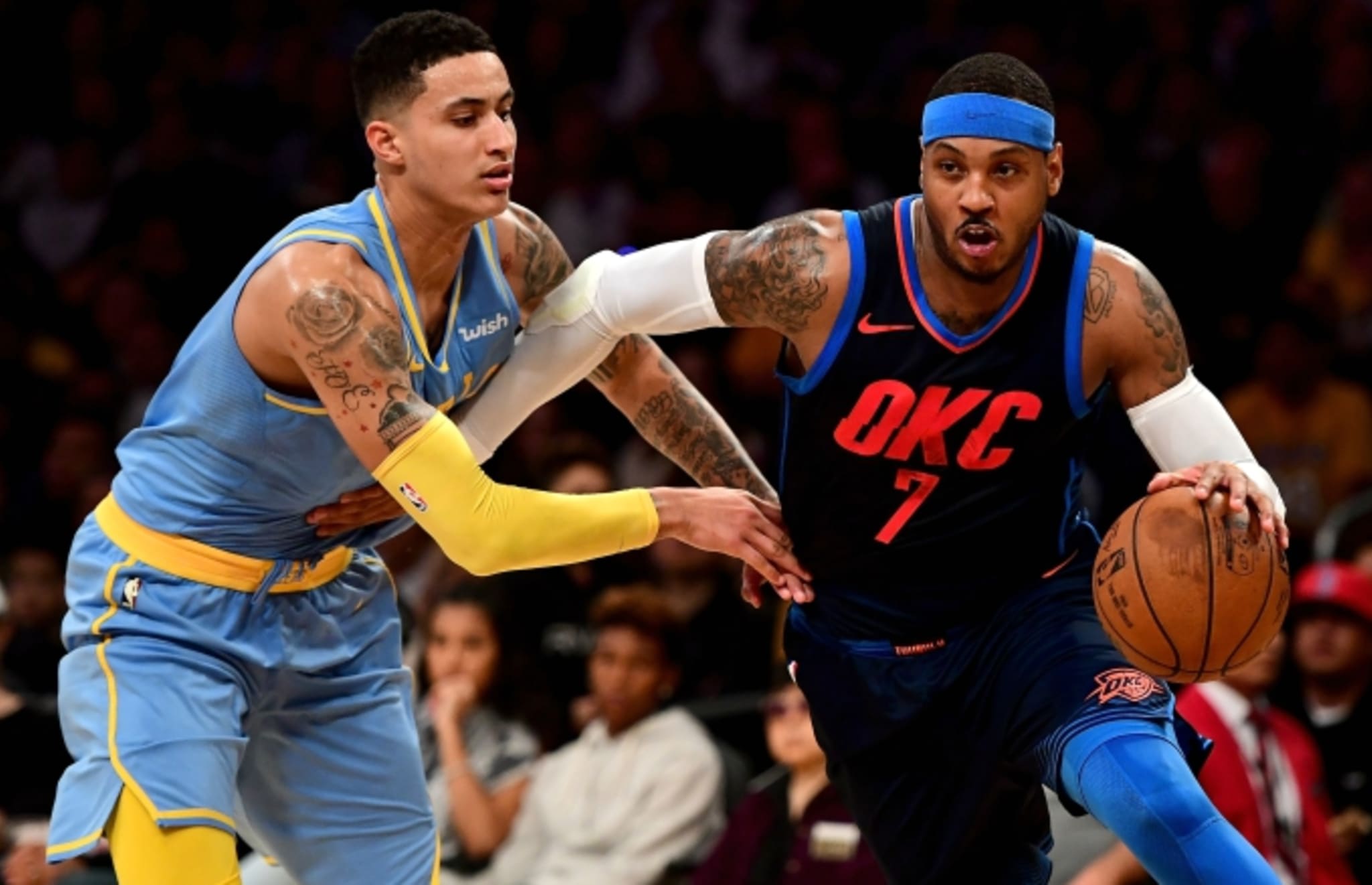 Kyle Kuzma guards Carmelo Anthony.