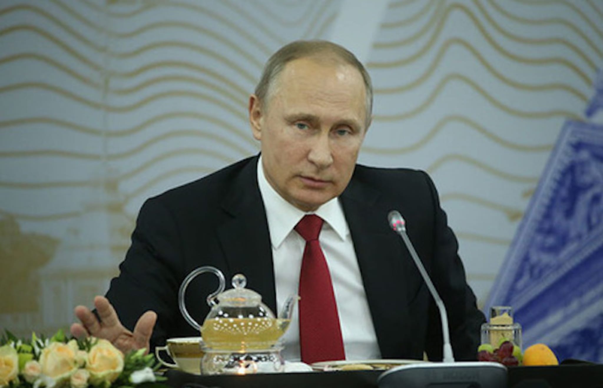 Putin addresses reporters.