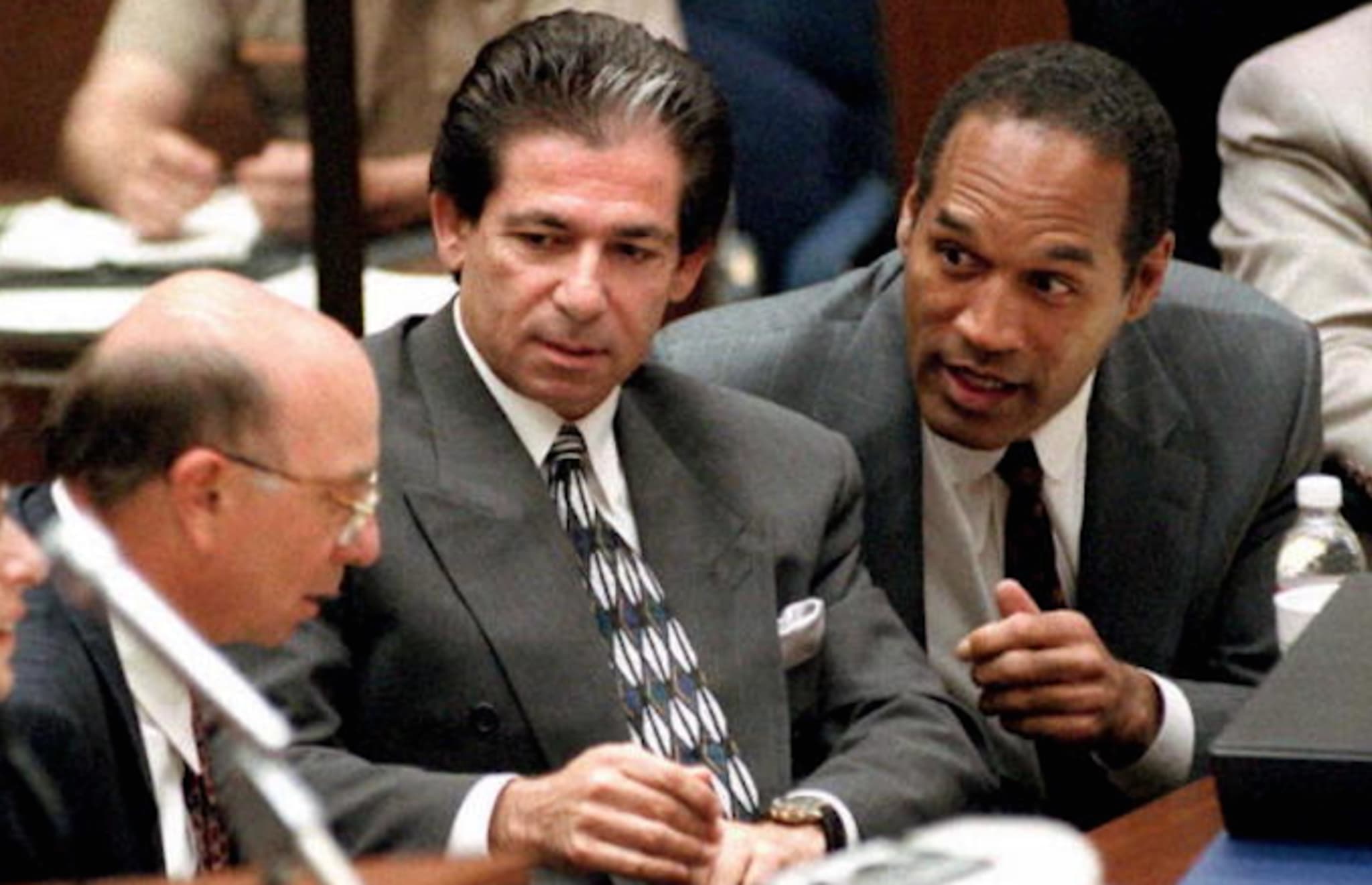 O.J. Simpson (R) consulting with friend Robert Kardashian